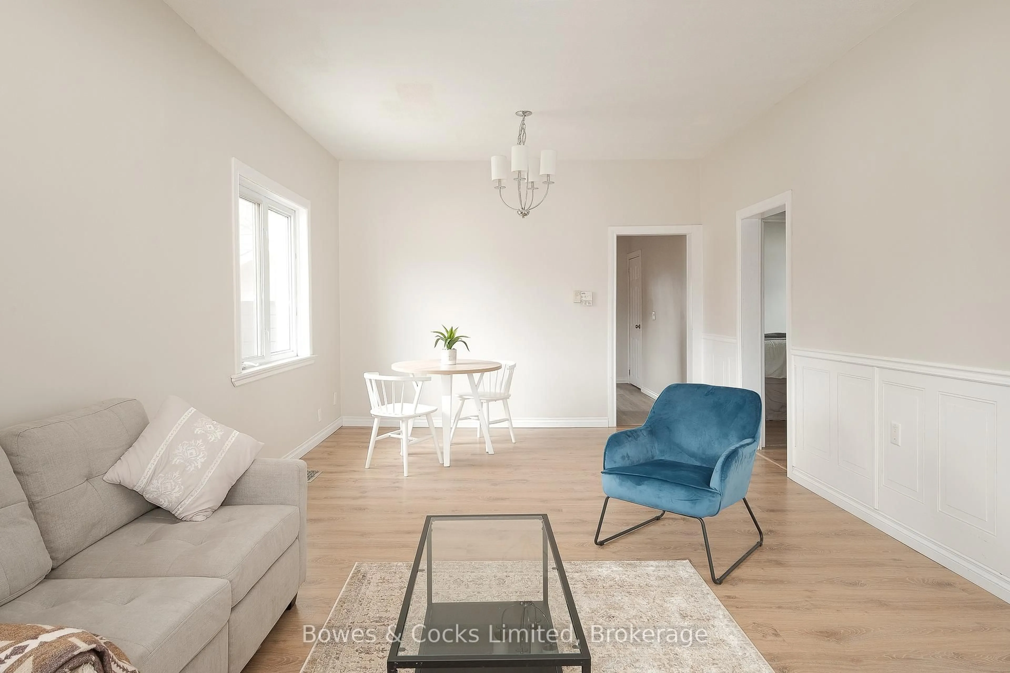 Living room with furniture, wood/laminate floor for 164 Prince St, Peterborough Ontario K9J 2A4