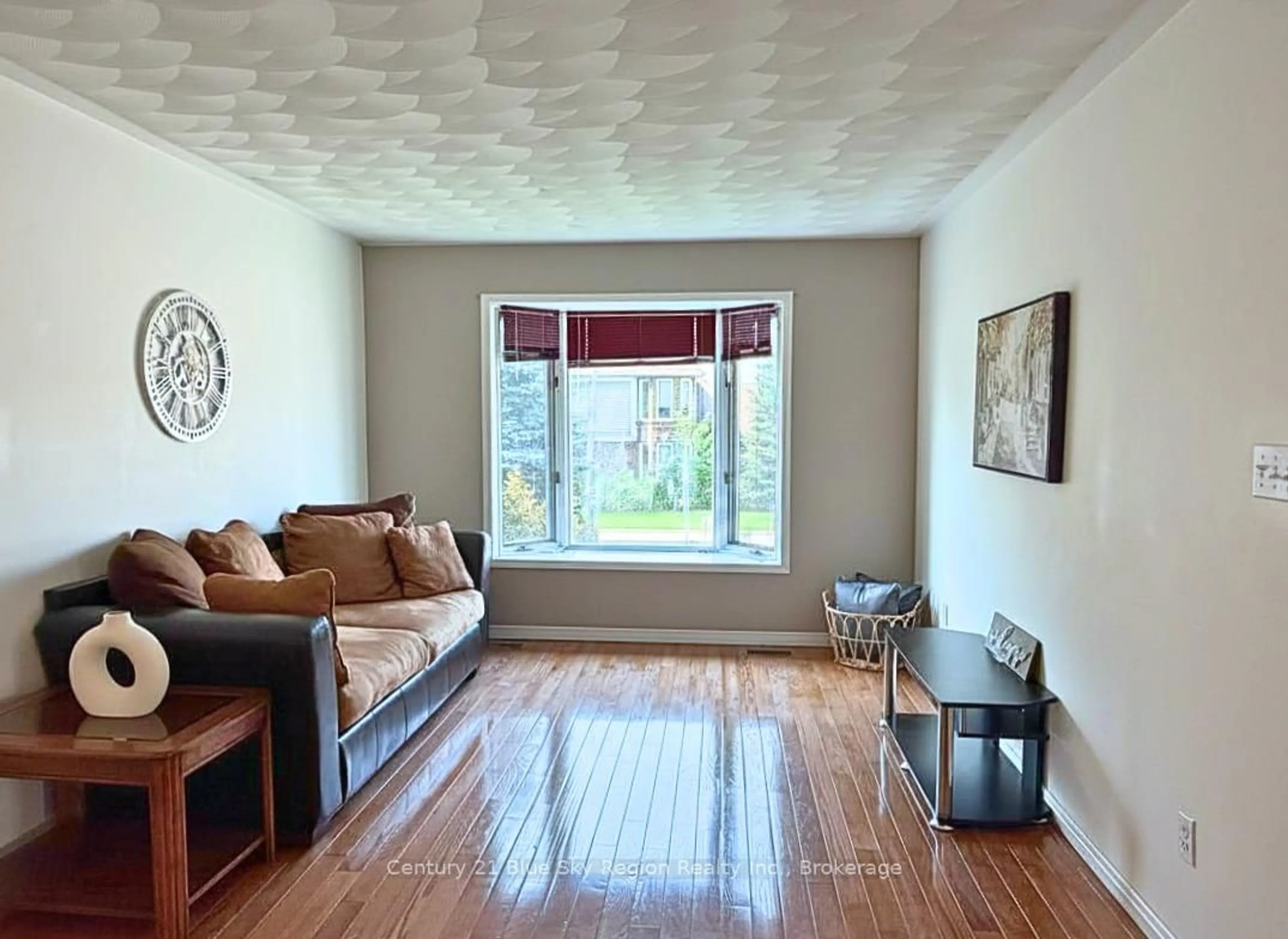 Living room with furniture, wood/laminate floor for 170 Cloverbrae Cres, North Bay Ontario P1A 4J3