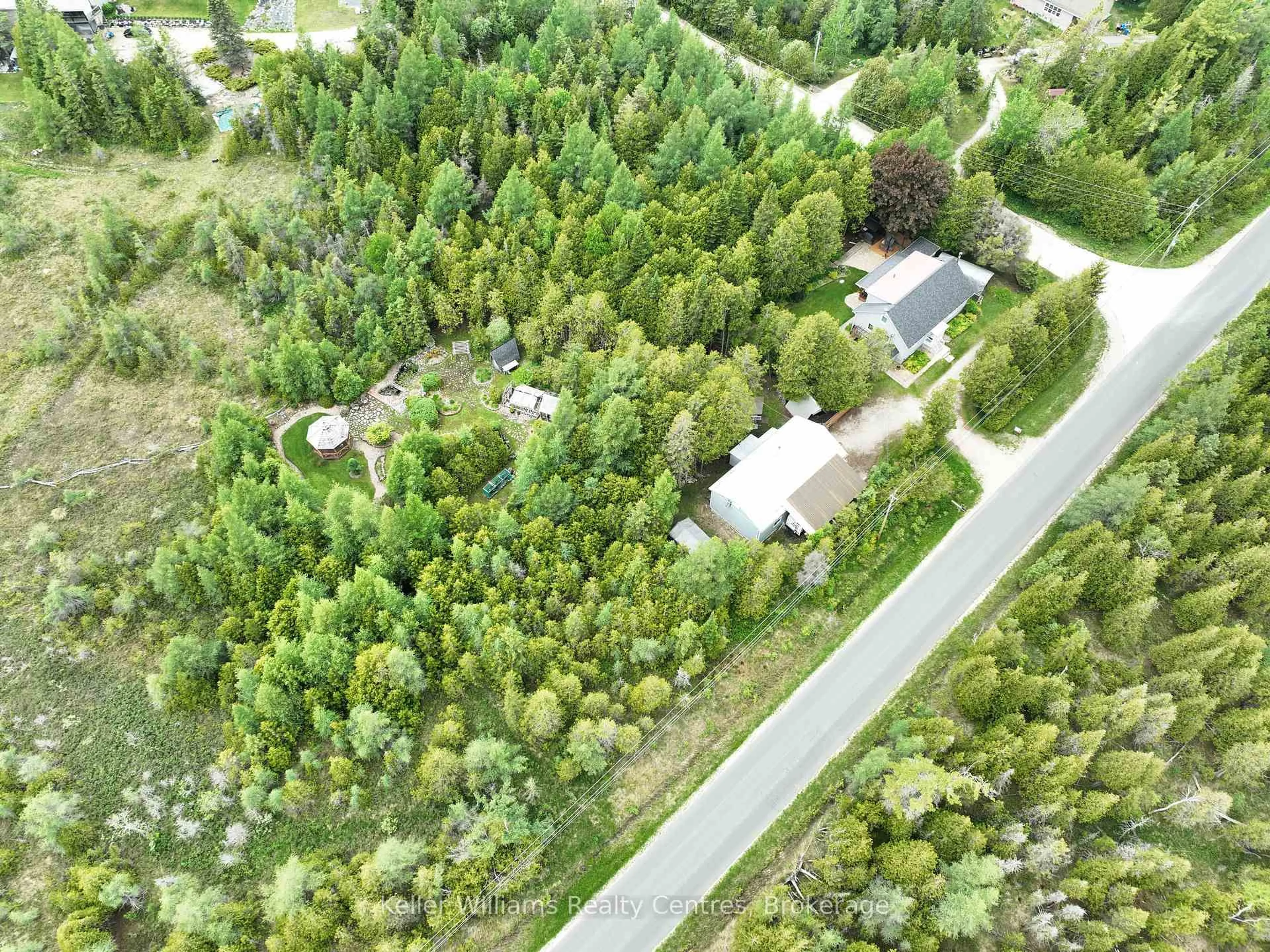 A pic from outside/outdoor area/front of a property/back of a property/a pic from drone, forest/trees view for 668 Pike Bay Rd, Northern Bruce Peninsula Ontario N0H 2T0