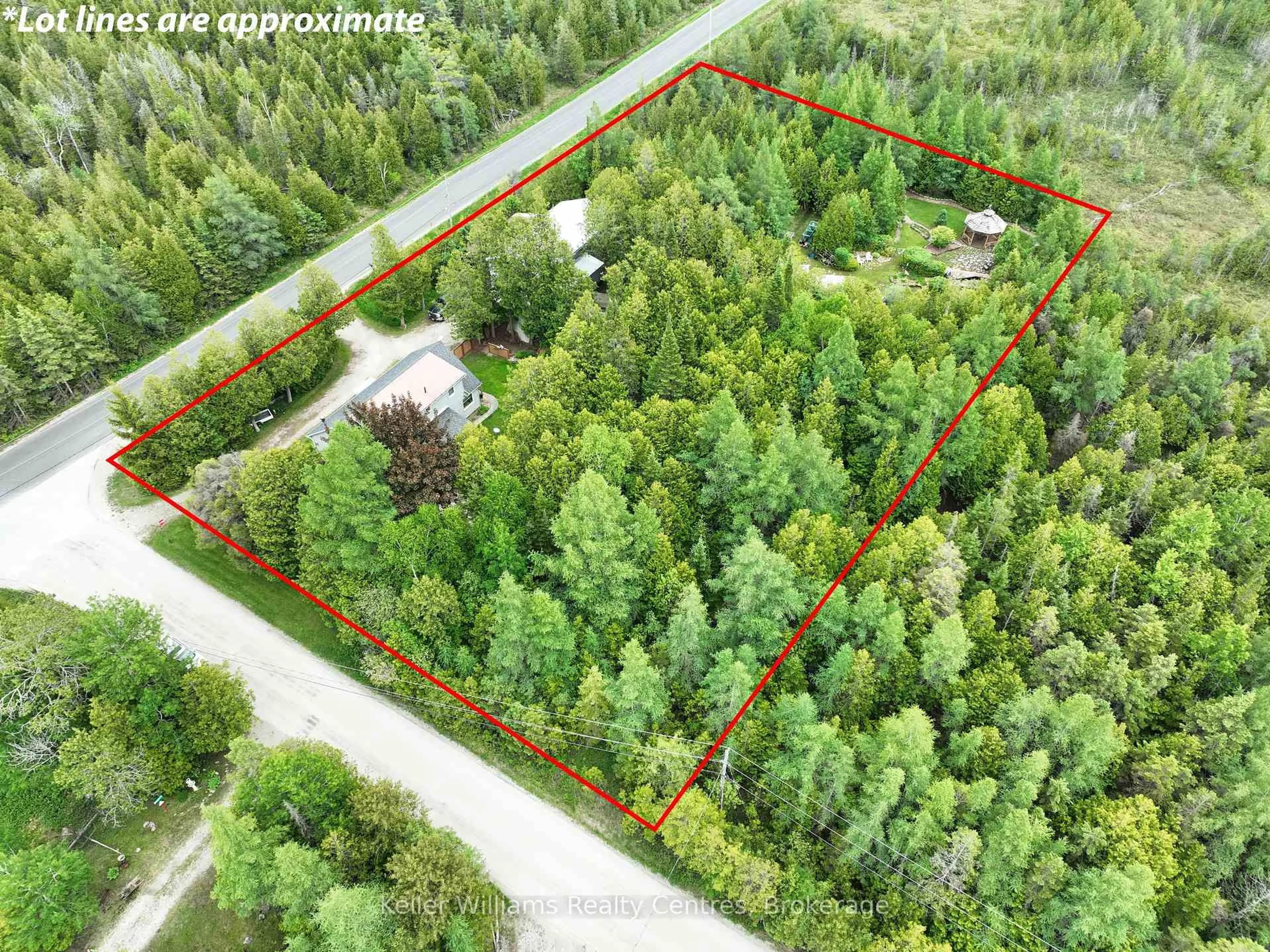 A pic from outside/outdoor area/front of a property/back of a property/a pic from drone, forest/trees view for 668 Pike Bay Rd, Northern Bruce Peninsula Ontario N0H 2T0