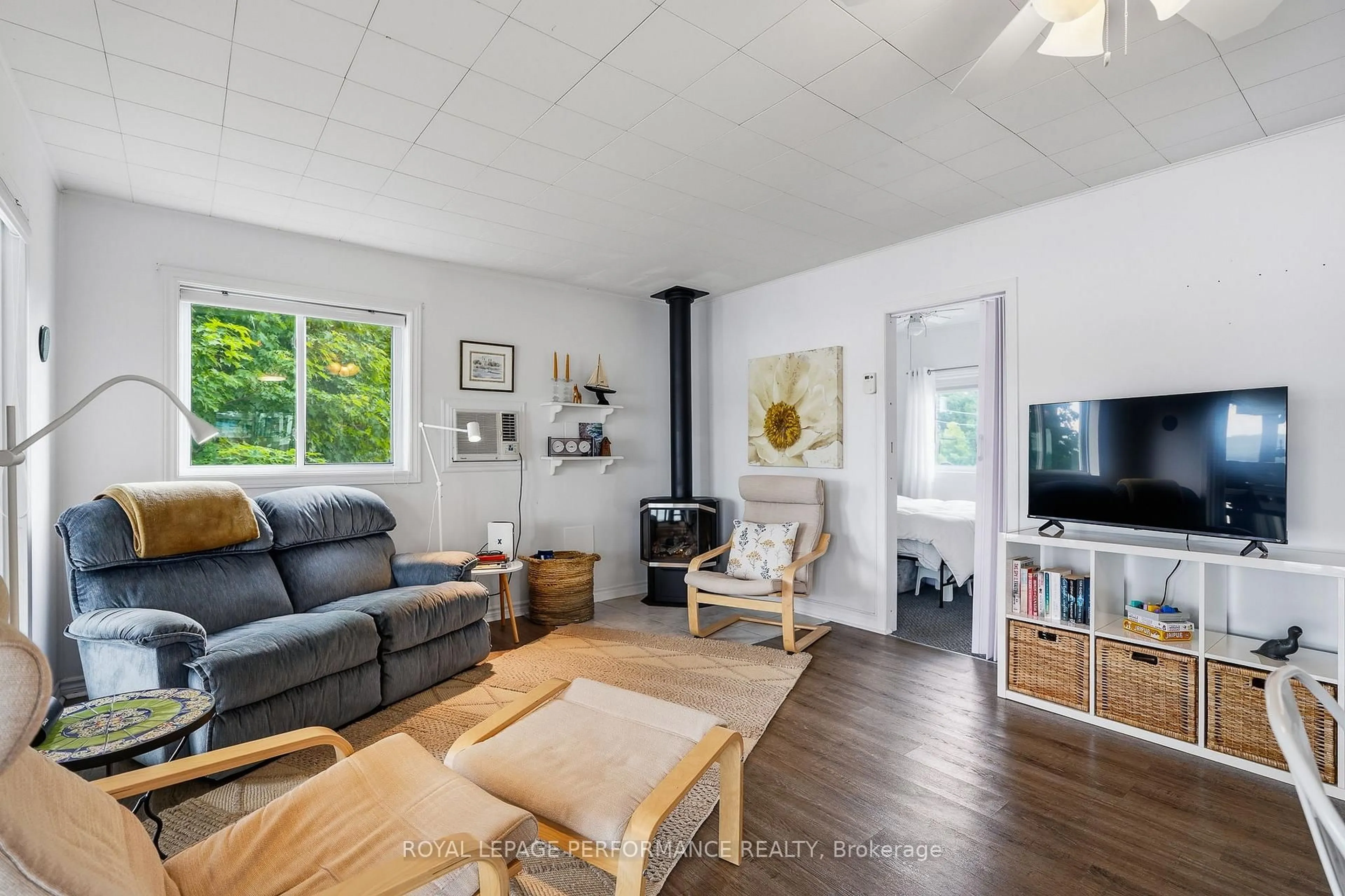 Living room with furniture, wood/laminate floor for 2473 Concession 1 Rd, Alfred and Plantagenet Ontario K0B 1J0