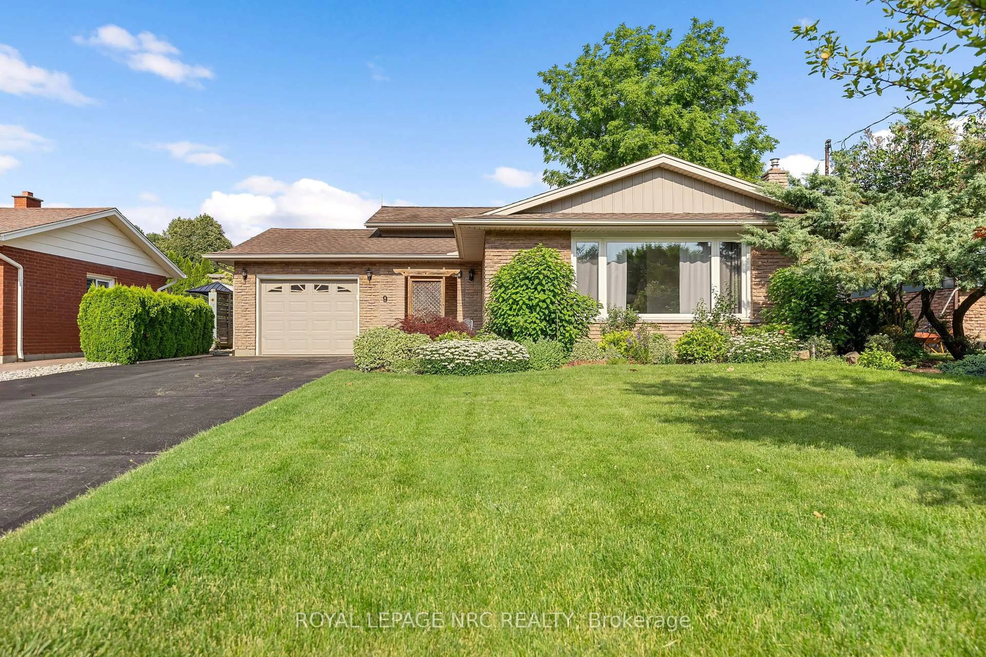 Home with brick exterior material, street for 9 Sandy Cove Dr, St. Catharines Ontario L2N 5Z3