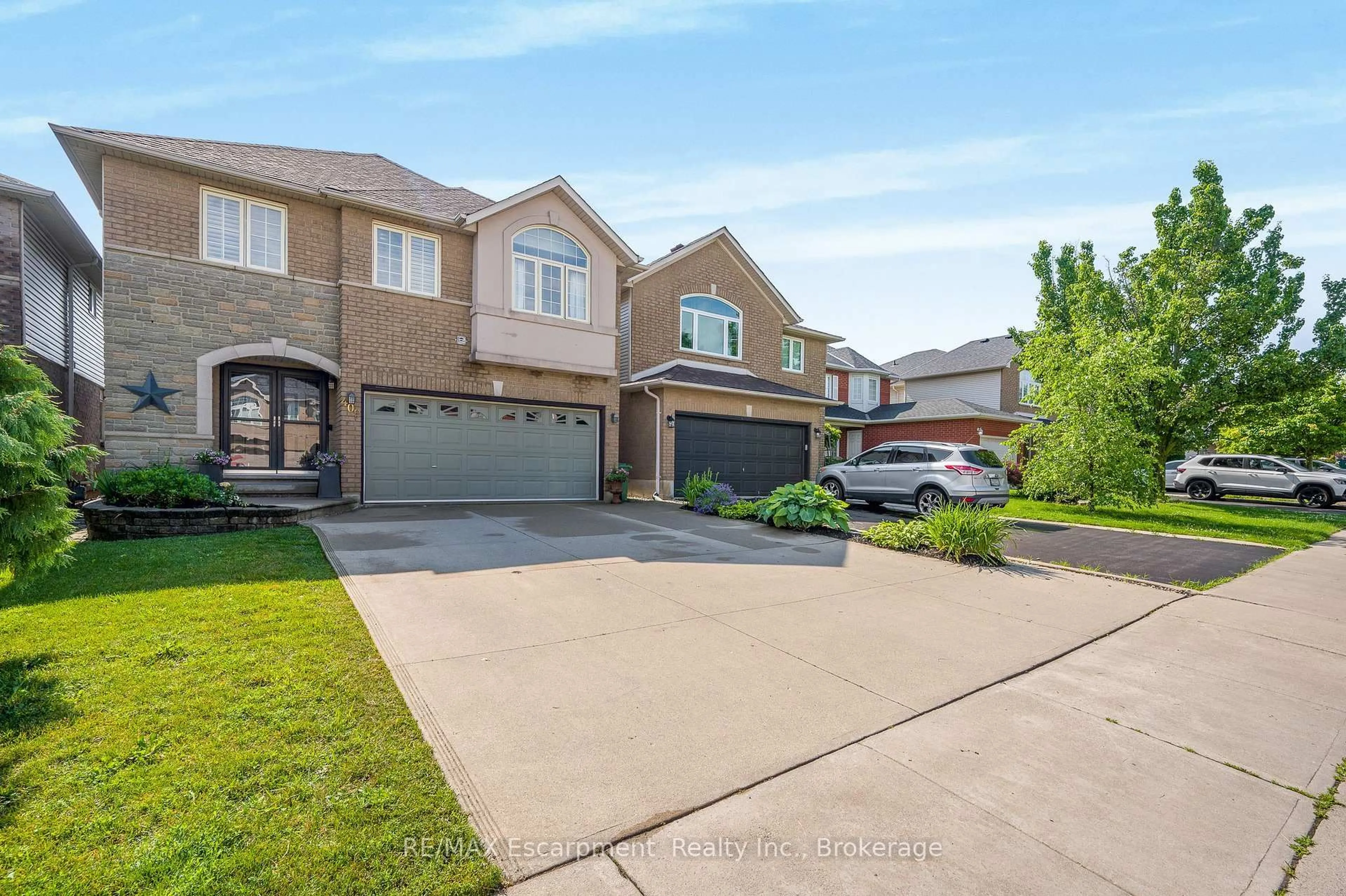 Home with brick exterior material, street for 409 Jacqueline Blvd, Hamilton Ontario L9B 2T4
