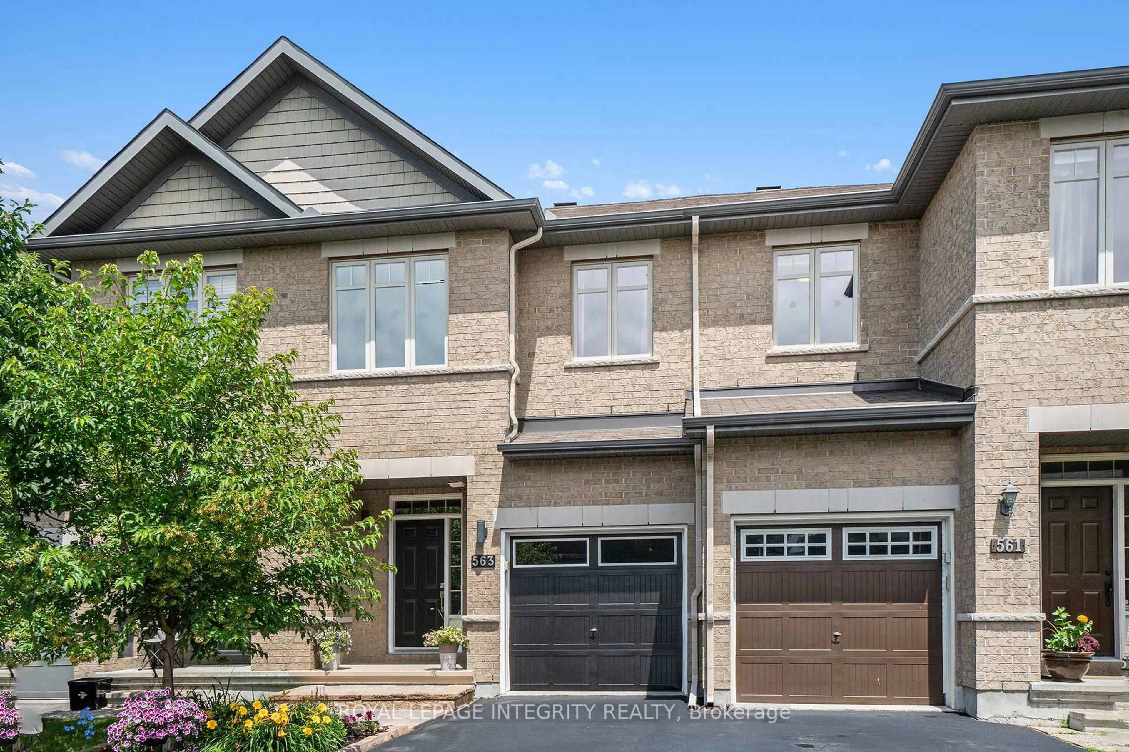 Home with brick exterior material, street for 563 Remnor Ave, Ottawa Ontario K2T 0A5