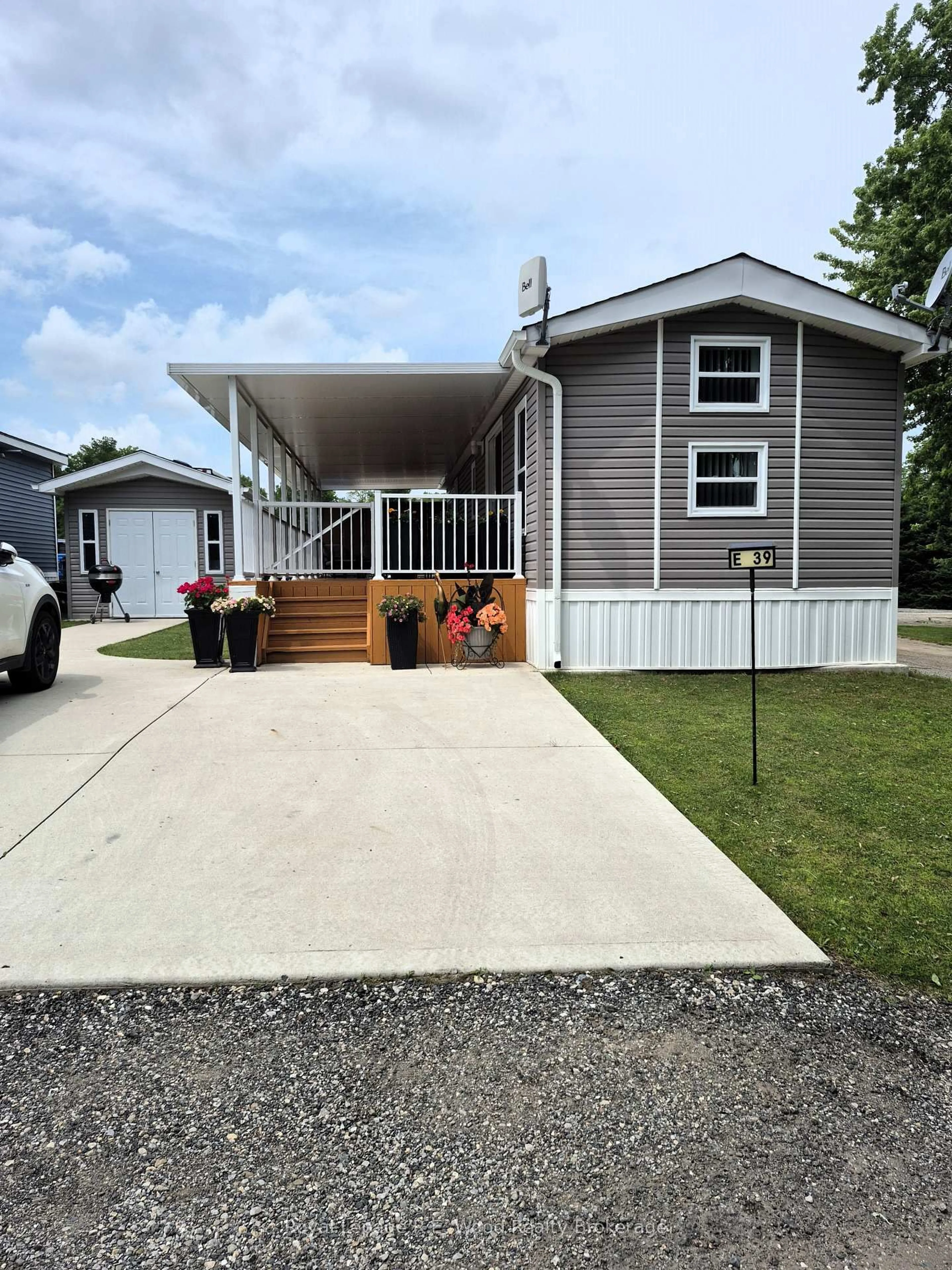 Home with vinyl exterior material, street for 4340 Cromarty Dr #E 39, Thames Centre Ontario N0L 1V0