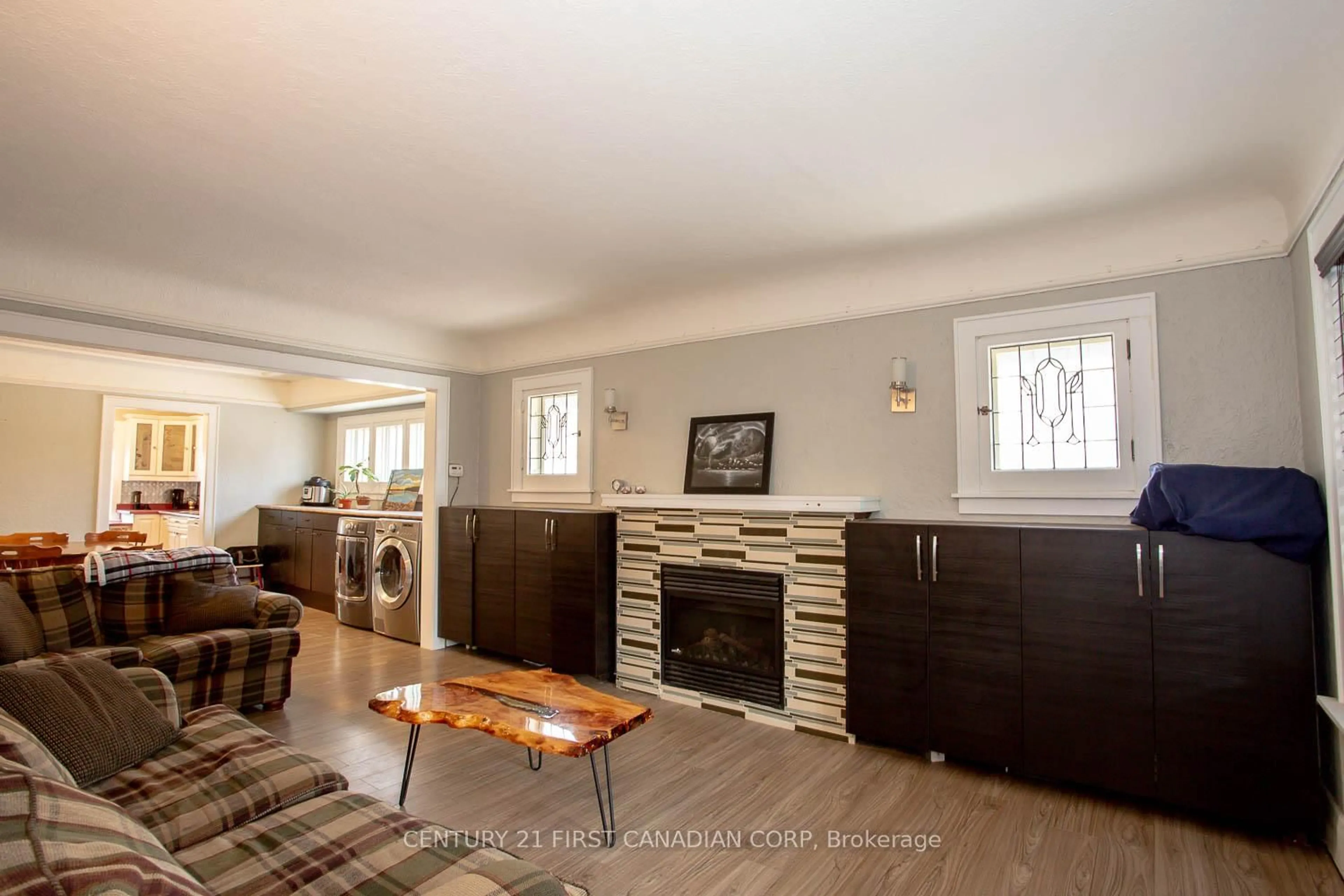 Living room with furniture, wood/laminate floor for 27 Wharncliffe Rd, London South Ontario N6J 2J5