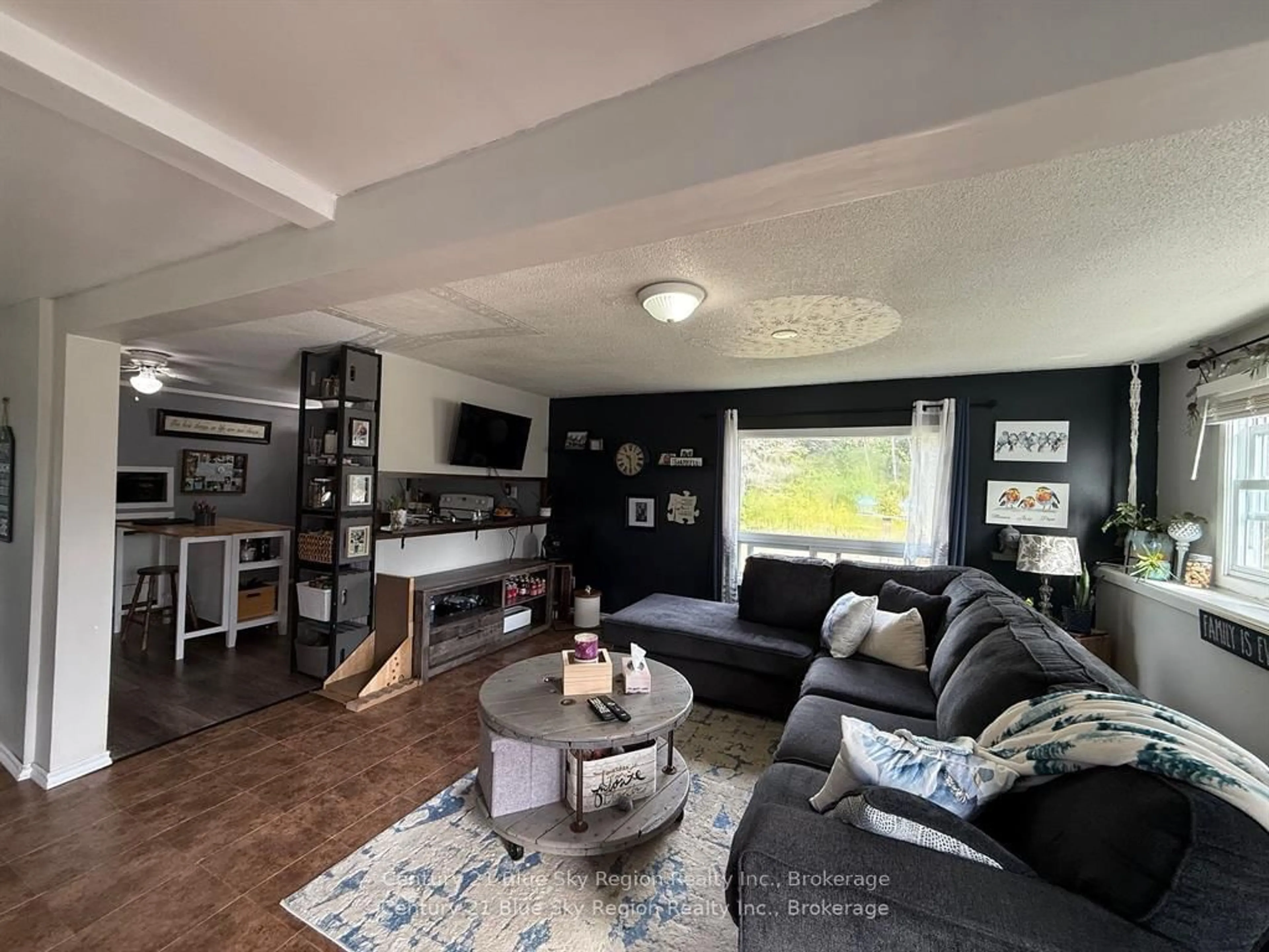 Living room with furniture, wood/laminate floor for 15 Church Rd ##B, Unorganized Townships Ontario P0H 2A0