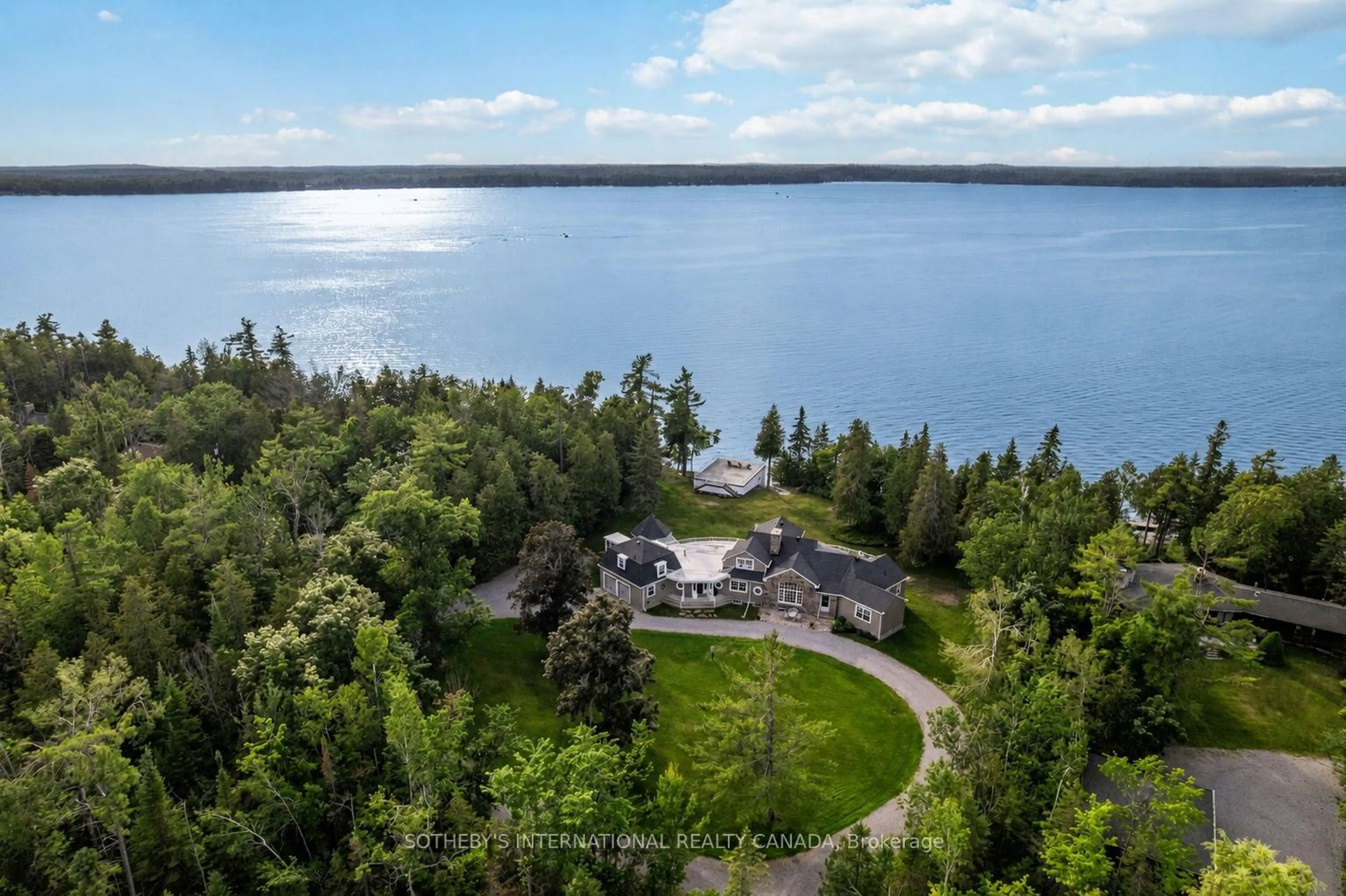 A pic from outside/outdoor area/front of a property/back of a property/a pic from drone, water/lake/river/ocean view for 101 Ridge Dr, Kawartha Lakes Ontario K0M 2B0