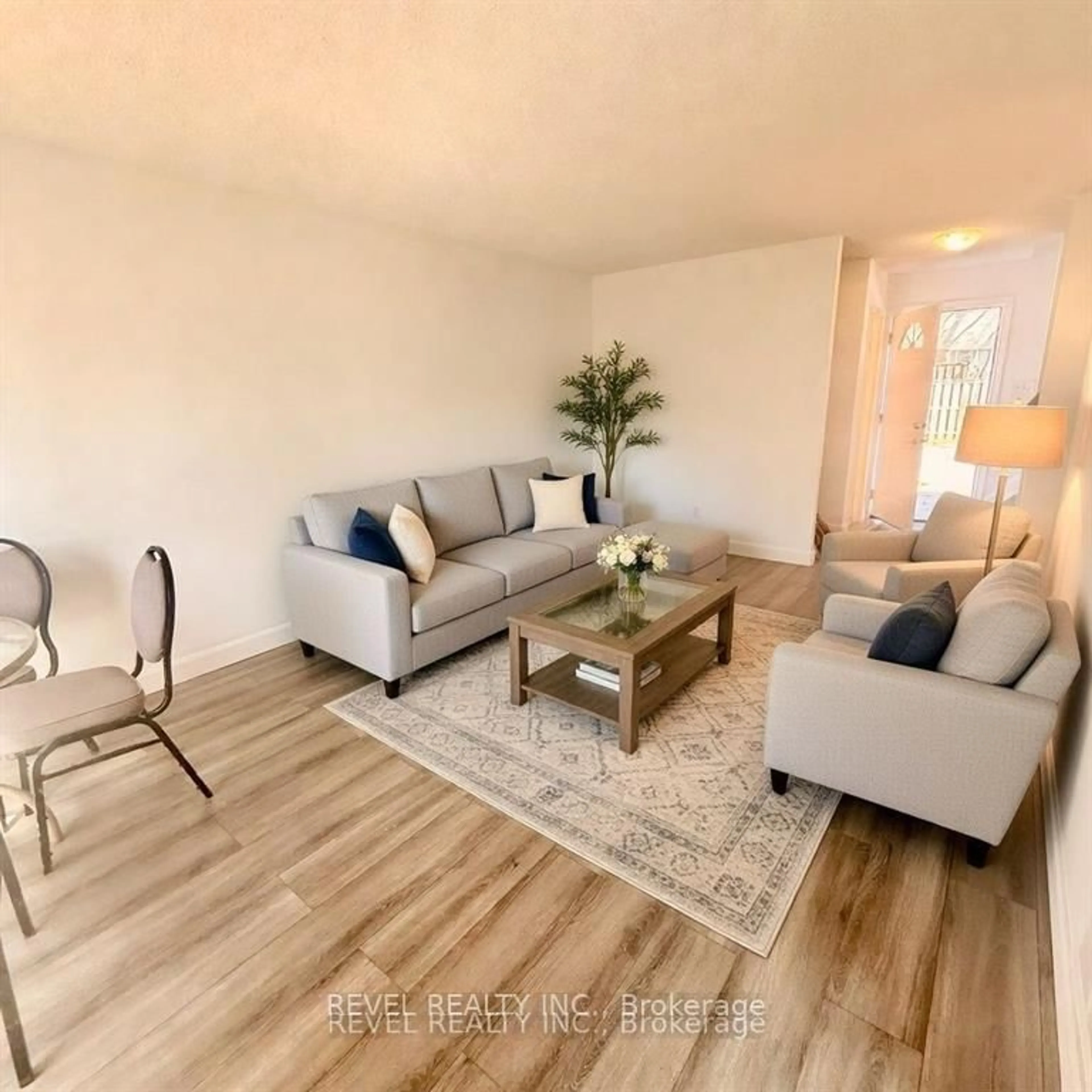 Living room with furniture, wood/laminate floor for 873 Southdale Rd, London South Ontario N6E 1V7