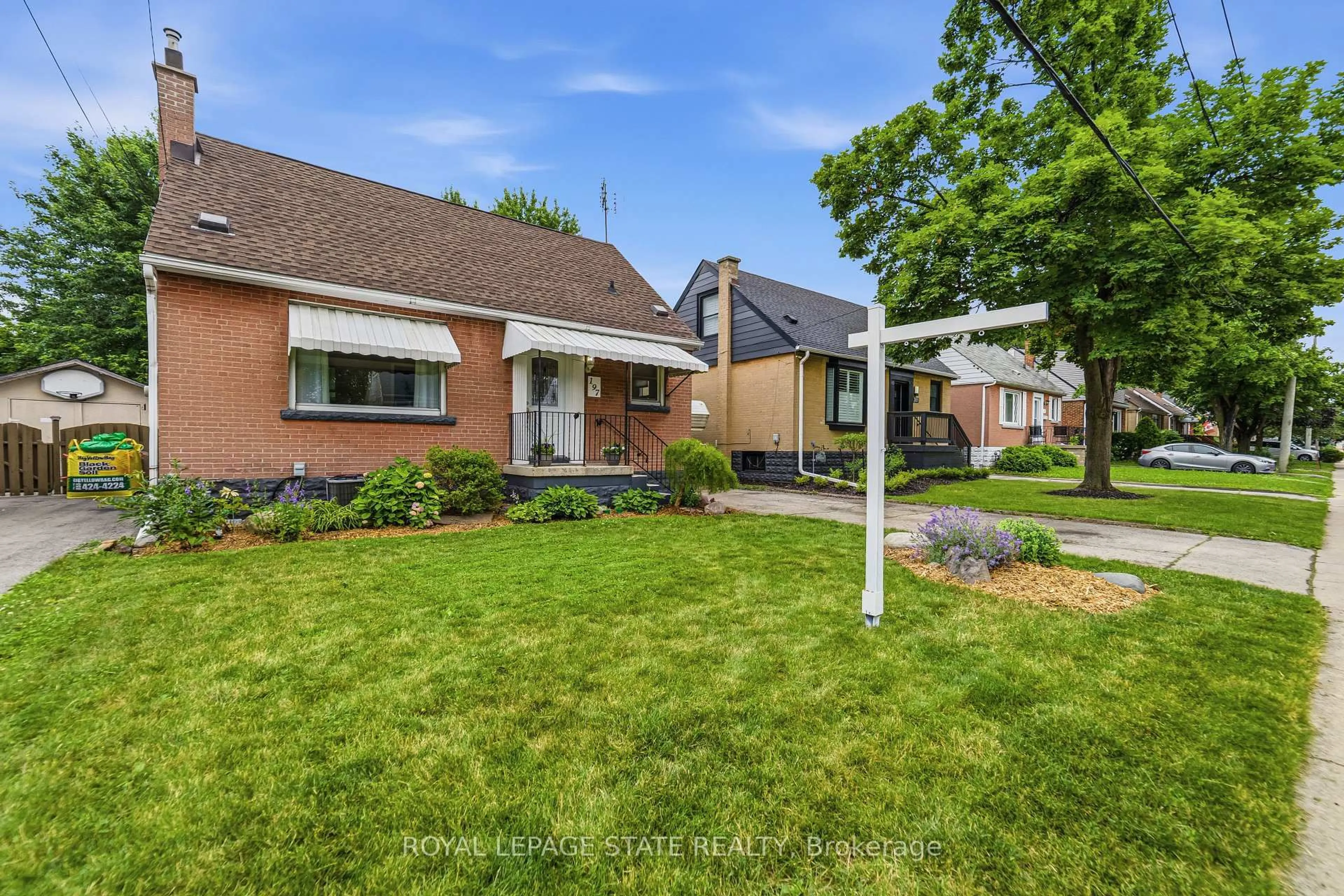 Home with brick exterior material, street for 197 East 12th St, Hamilton Ontario L9A 3X5
