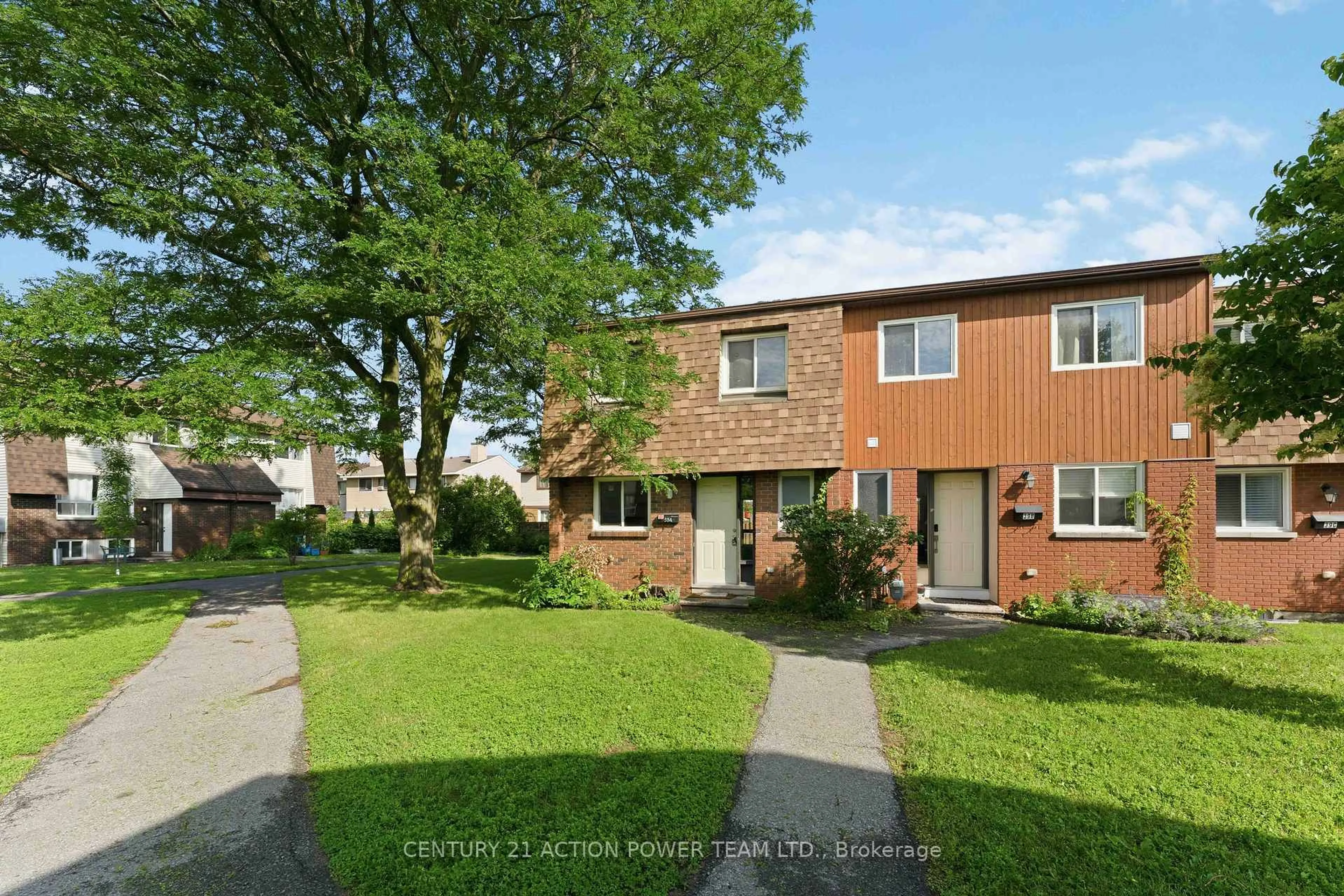 A pic from outside/outdoor area/front of a property/back of a property/a pic from drone, street for 39 Woodvale Green Dr #A, Ottawa Ontario K2G 4H3