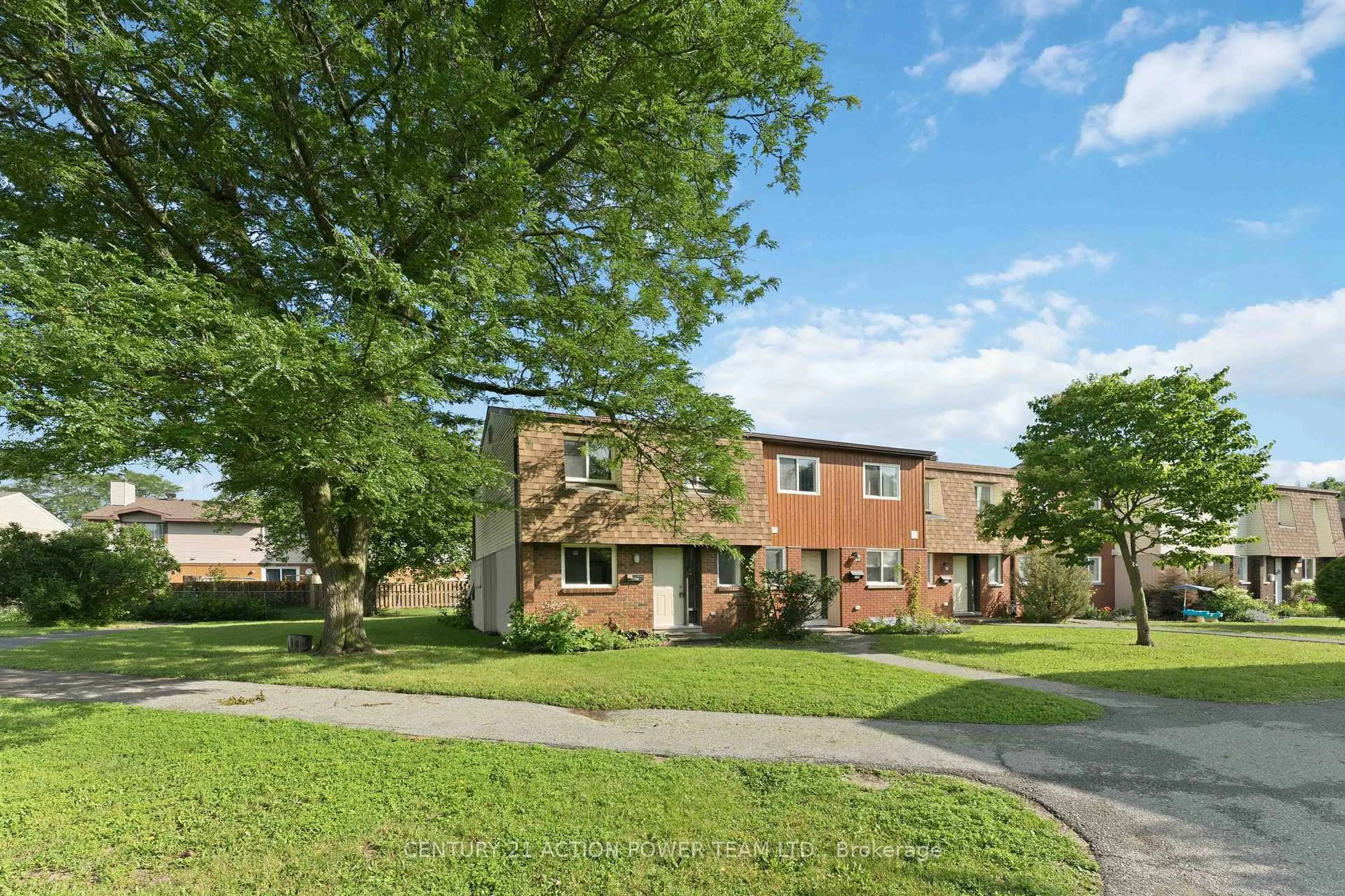 Home with brick exterior material, street for 39 Woodvale Green Dr #A, Ottawa Ontario K2G 4H3