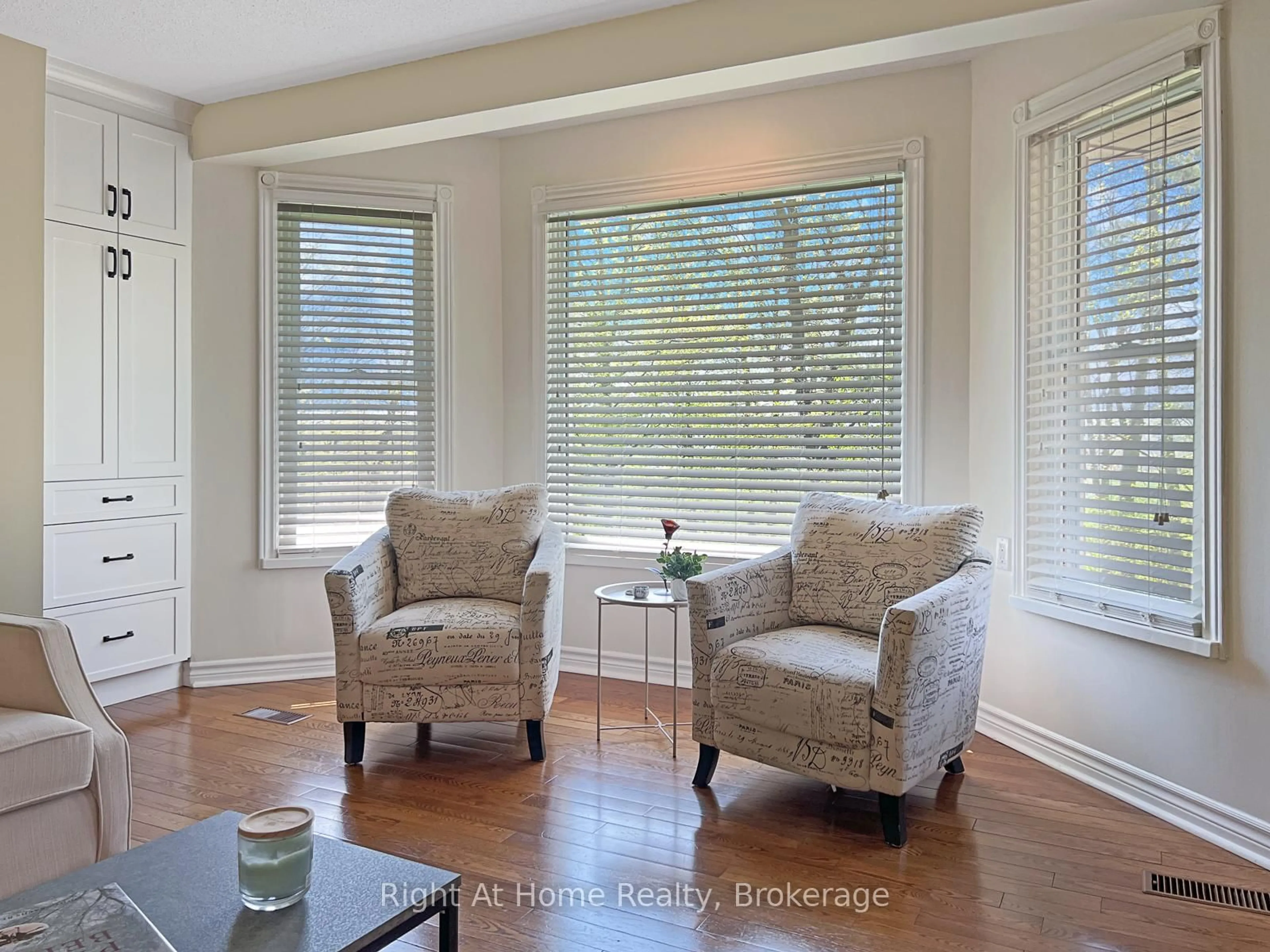 Living room with furniture, wood/laminate floor for 919 Jamieson Rd, Quinte West Ontario K0K 3M0