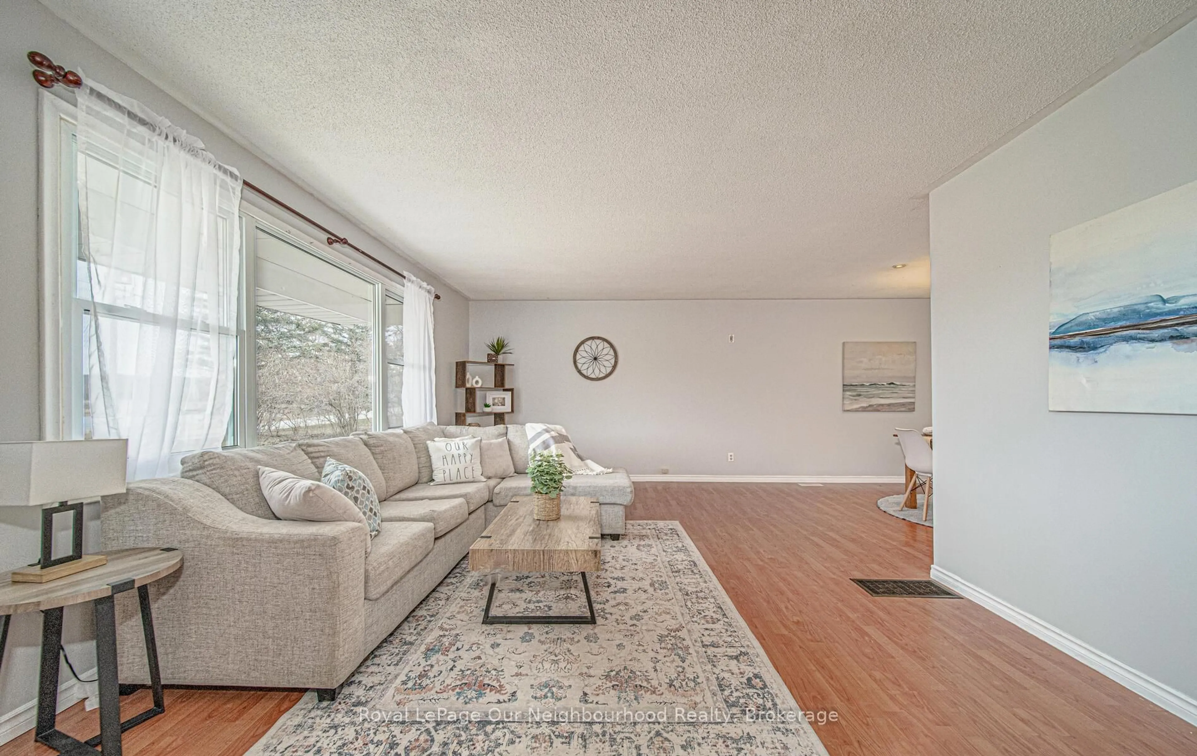 Living room with furniture, wood/laminate floor for 717 Concession 3 Rd, Trent Hills Ontario K0K 3K0