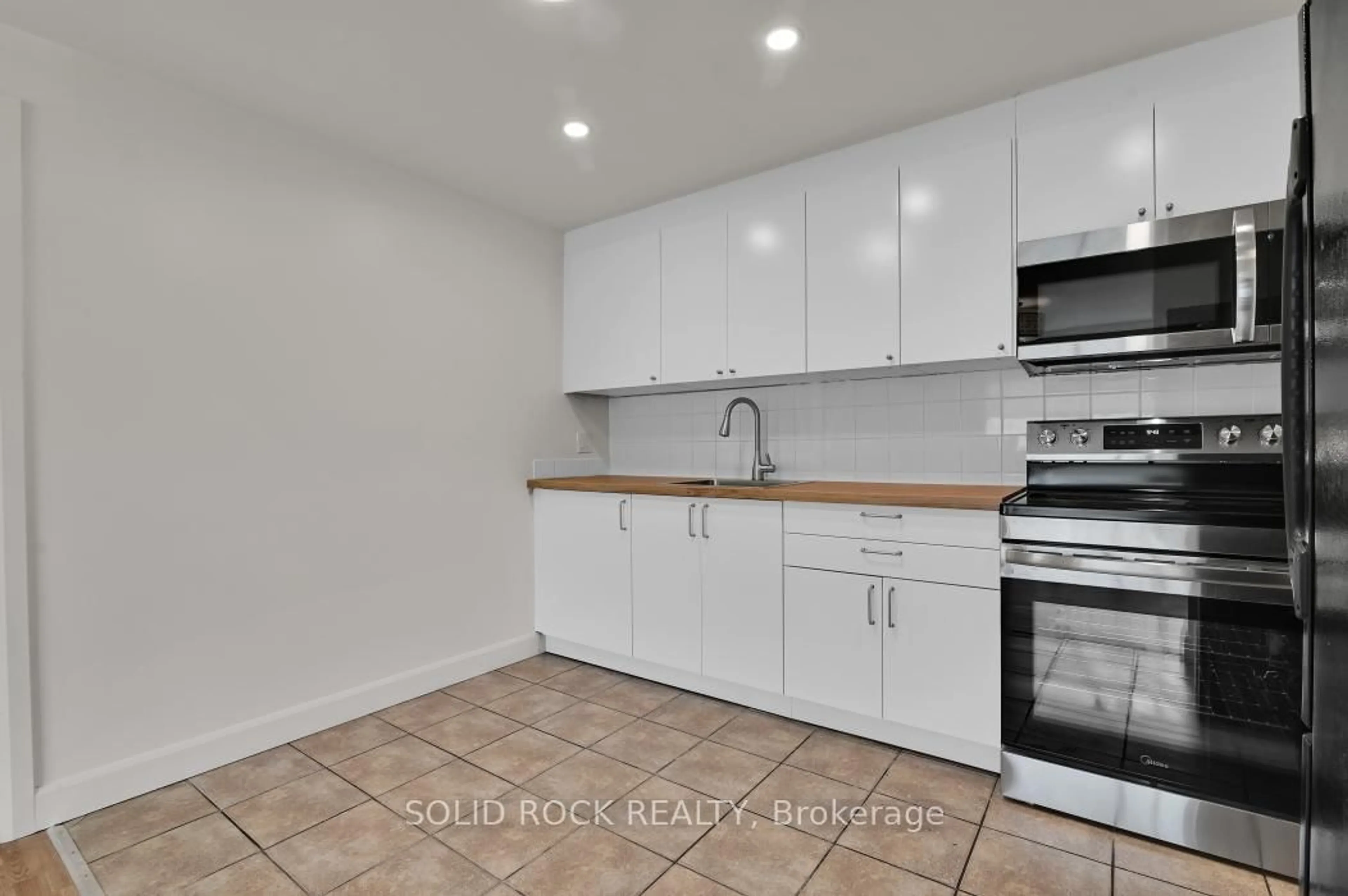 Standard kitchen, ceramic/tile floor for 896 Elmsmere Dr #7, Ottawa Ontario K1J 7T6