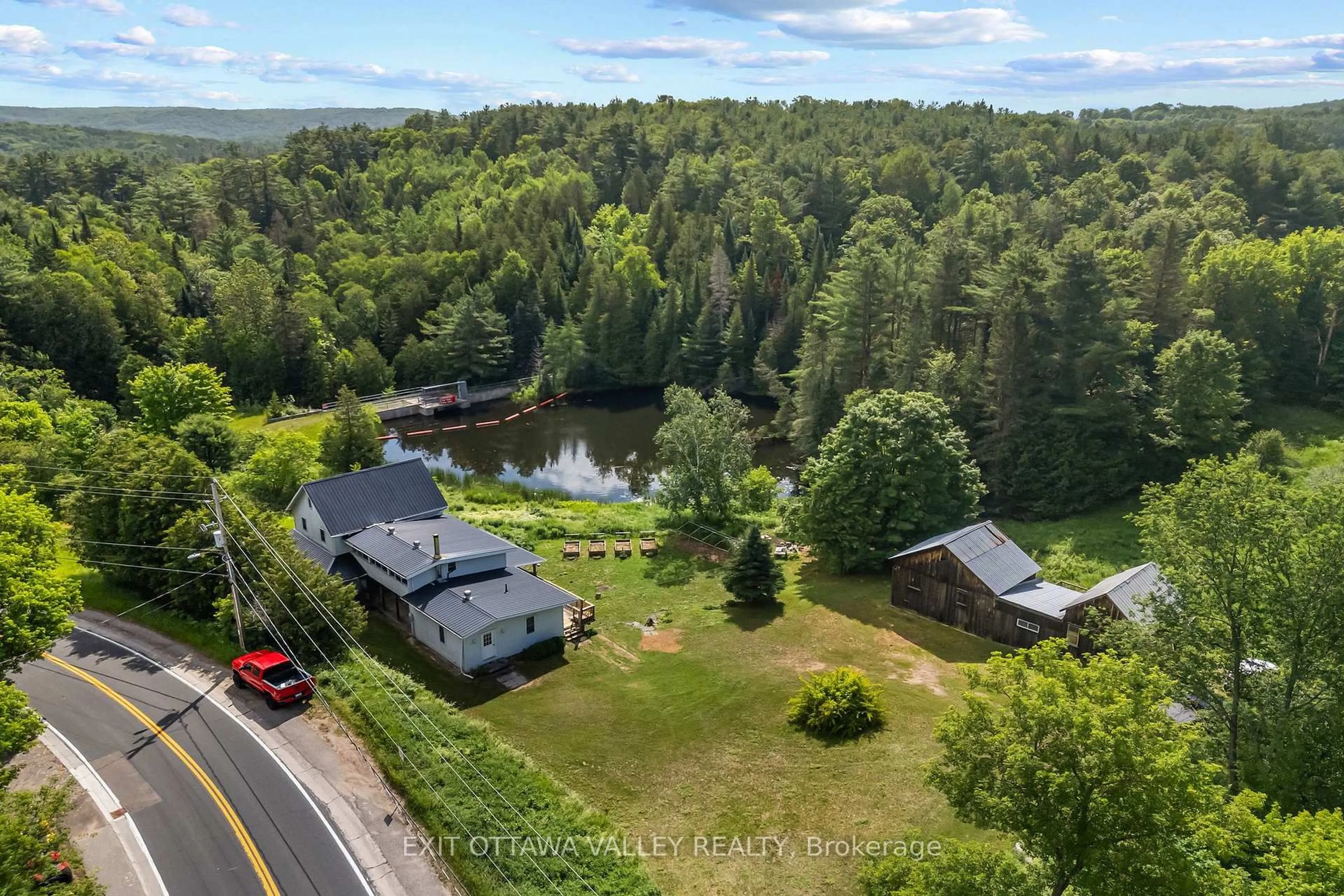 A pic from outside/outdoor area/front of a property/back of a property/a pic from drone, water/lake/river/ocean view for 162 Highway No. 28, Denbigh Ontario K0H 1L0