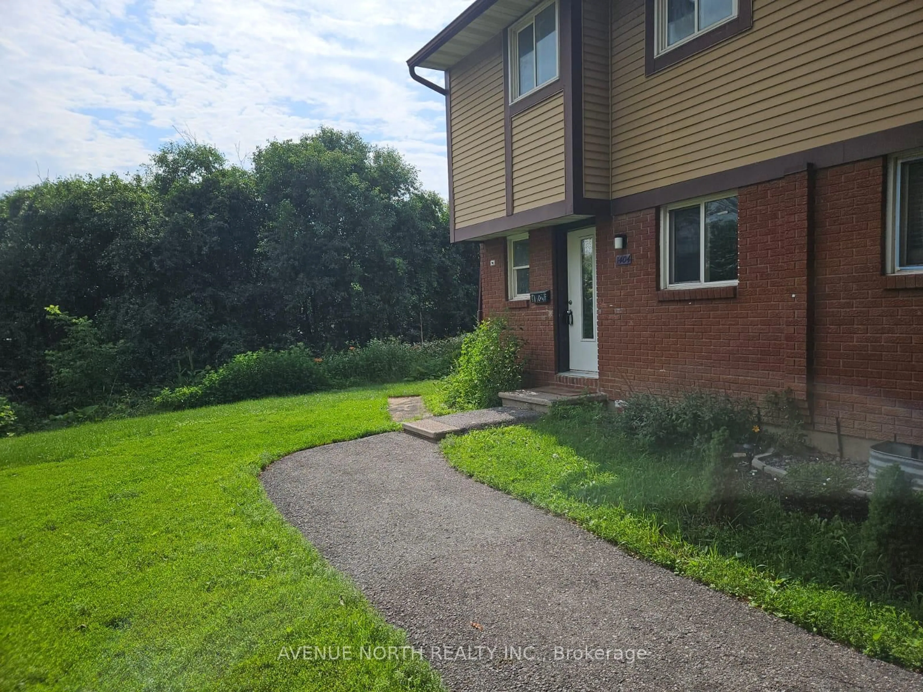 A pic from outside/outdoor area/front of a property/back of a property/a pic from drone, street for 1404 Foxwell St #1, Ottawa Ontario K1B 5J4