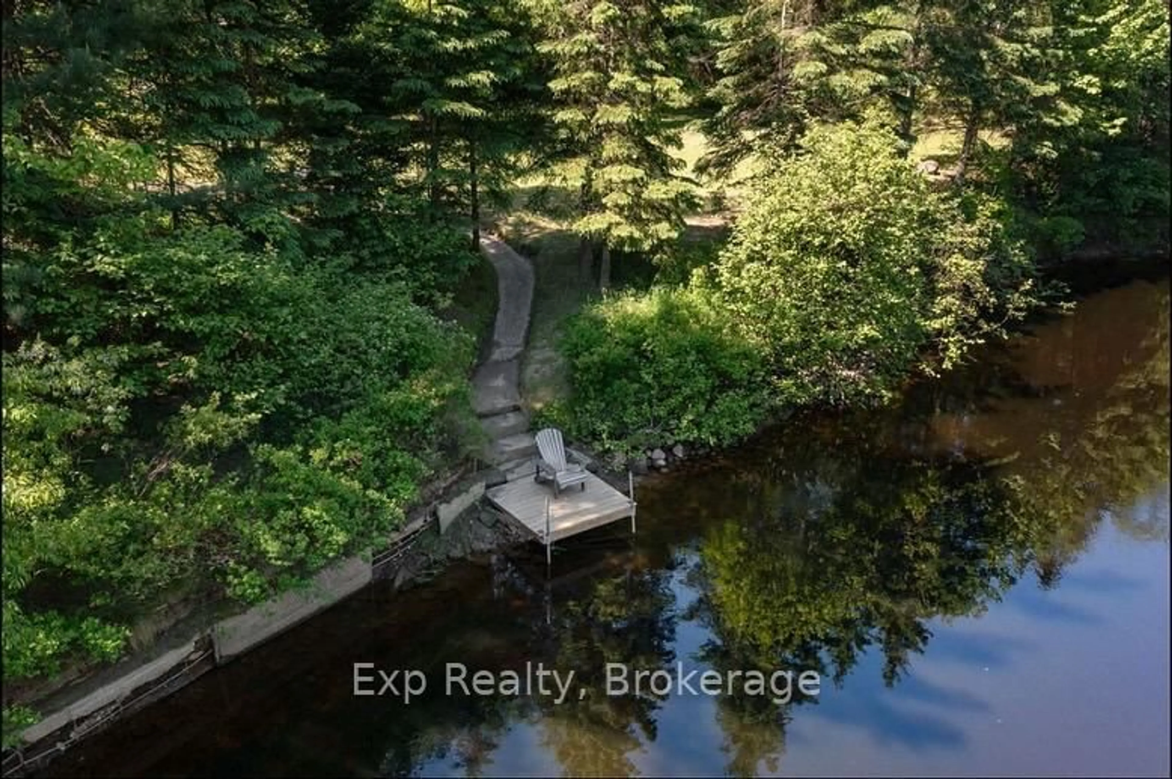 A pic from outside/outdoor area/front of a property/back of a property/a pic from drone, water/lake/river/ocean view for 27 Groeger Rd, Huntsville Ontario P1H 2J4