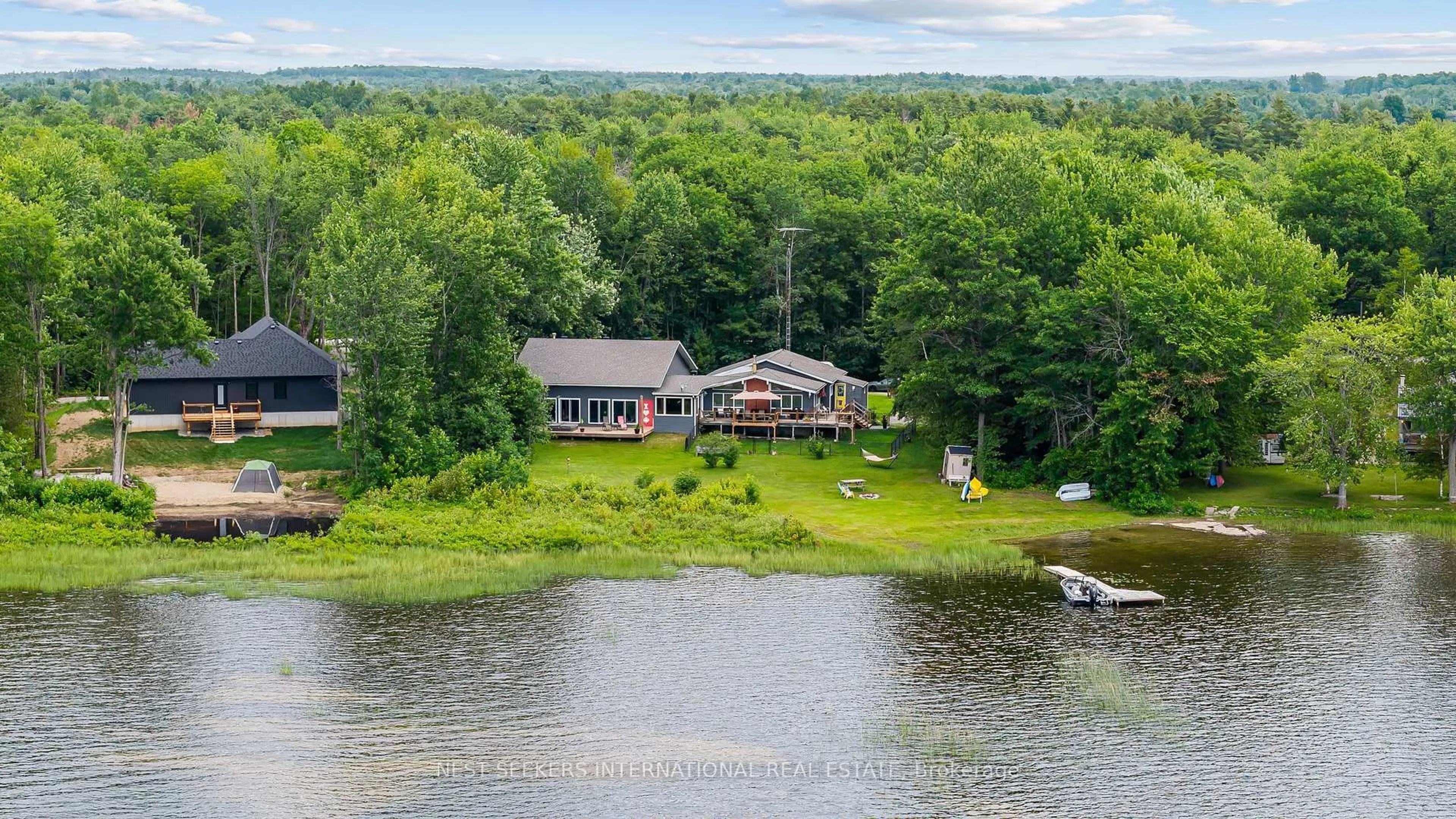 A pic from outside/outdoor area/front of a property/back of a property/a pic from drone, water/lake/river/ocean view for 27 Young St, Kawartha Lakes Ontario L0K 1W0