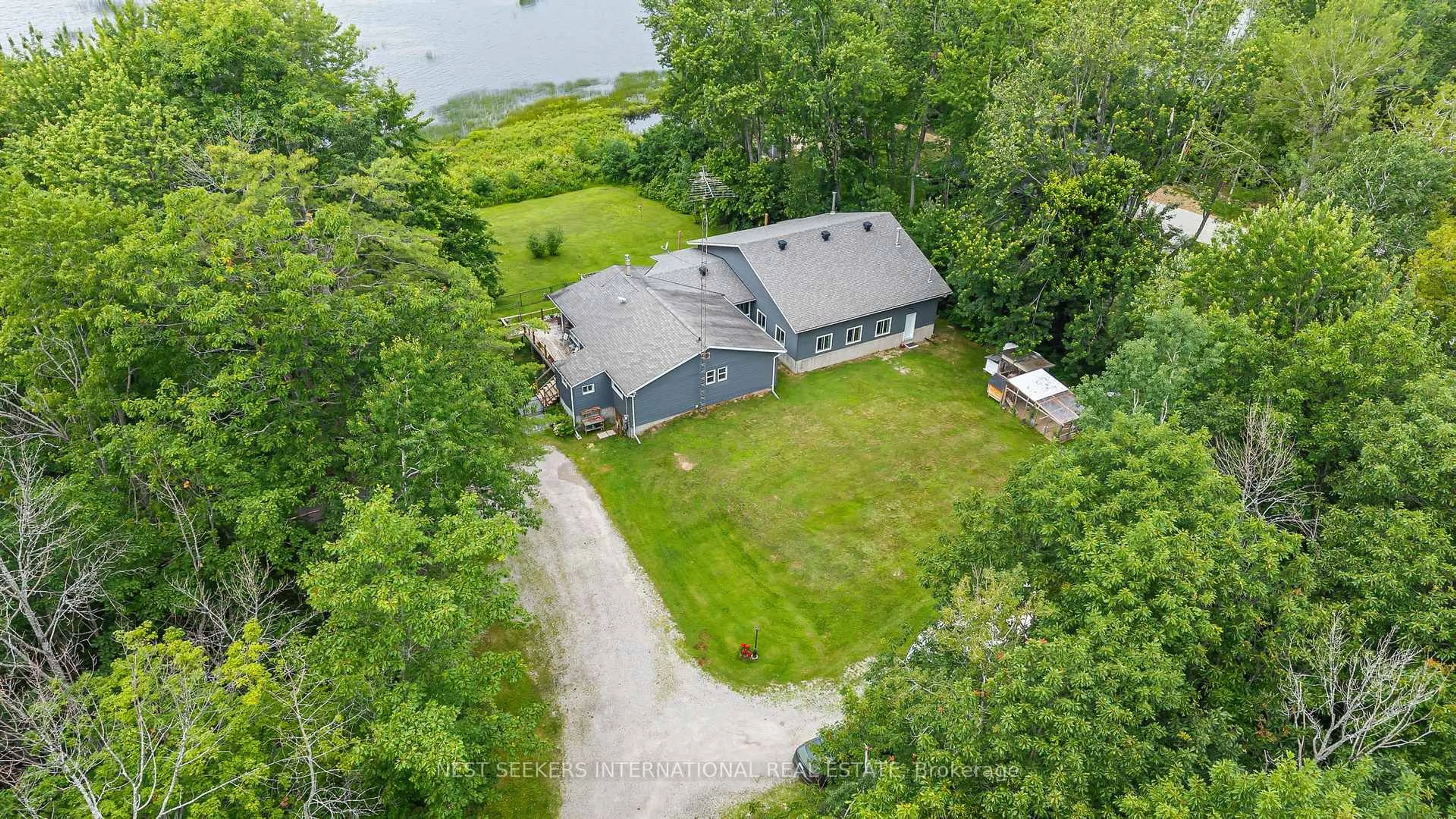 A pic from outside/outdoor area/front of a property/back of a property/a pic from drone, water/lake/river/ocean view for 27 Young St, Kawartha Lakes Ontario L0K 1W0