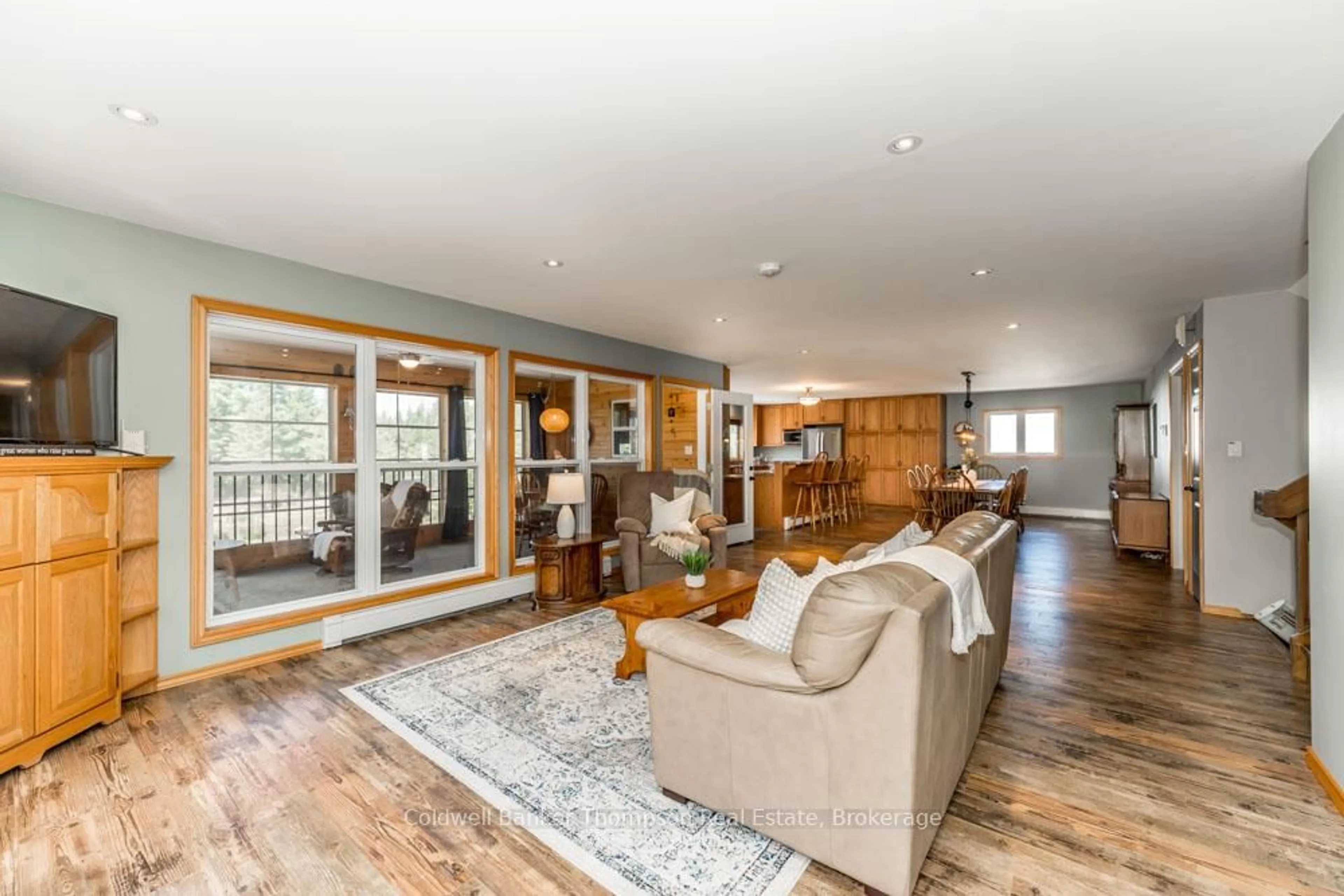 Living room with furniture, wood/laminate floor for 57 Rattray Rd, Perry Ontario P0A 1J0