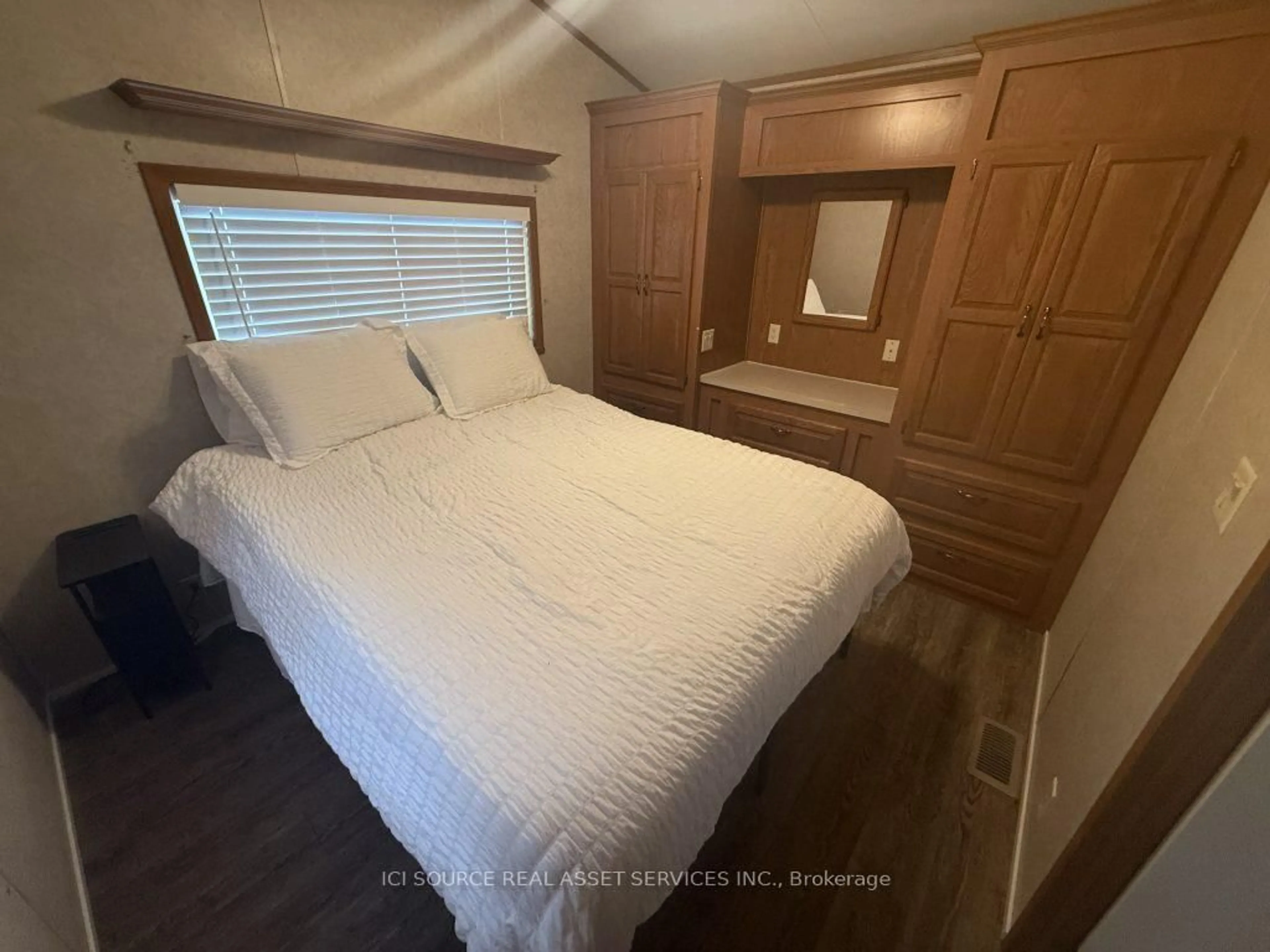 Bedroom with bed, wood/laminate floor for 7100 County Rd 18 #SBR620, Alnwick/Haldimand Ontario K0K 2X0