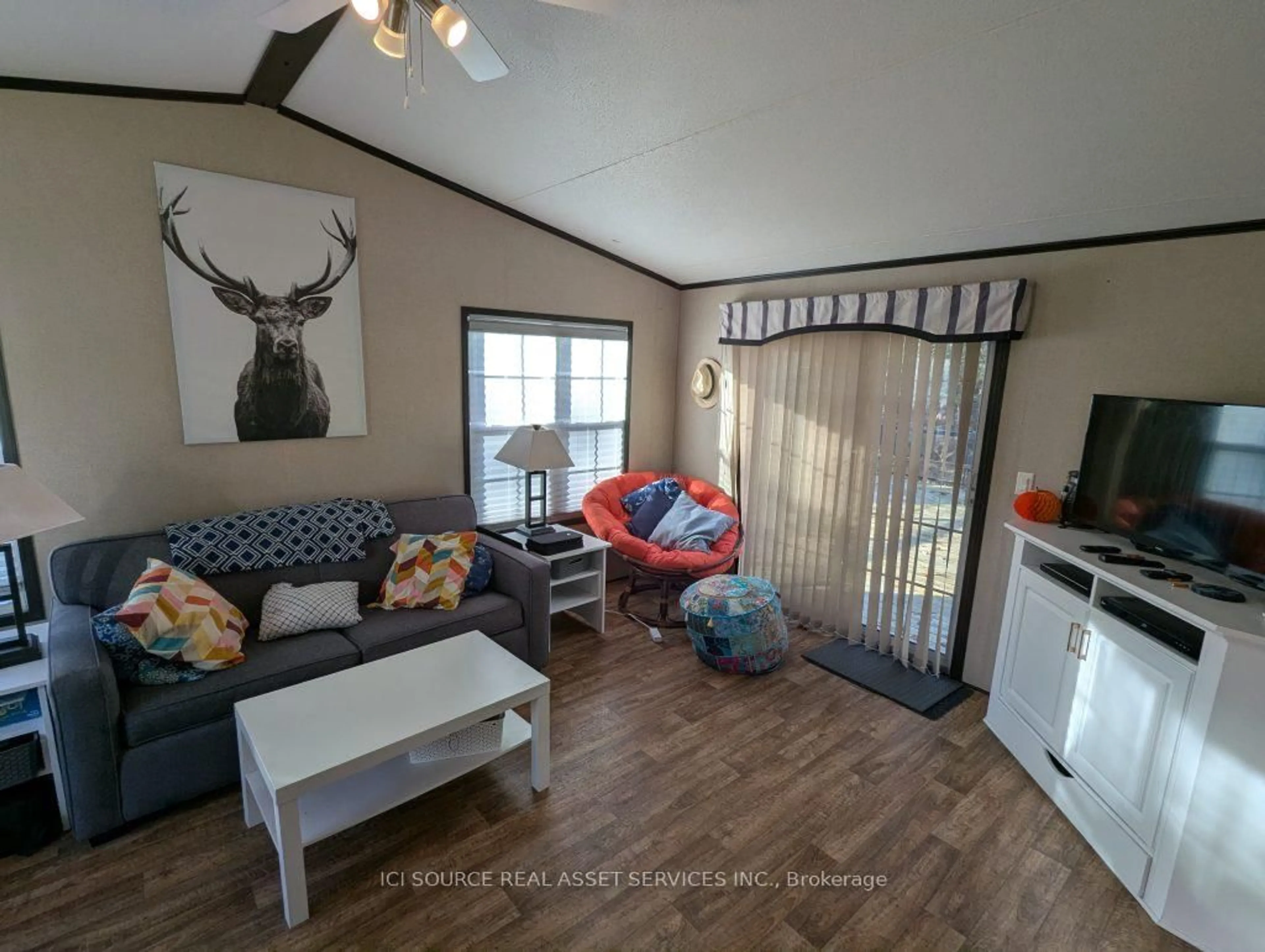 Living room with furniture, wood/laminate floor for 1336 S Morrison Lake Rd #MOR14, Gravenhurst Ontario P0E 1G0