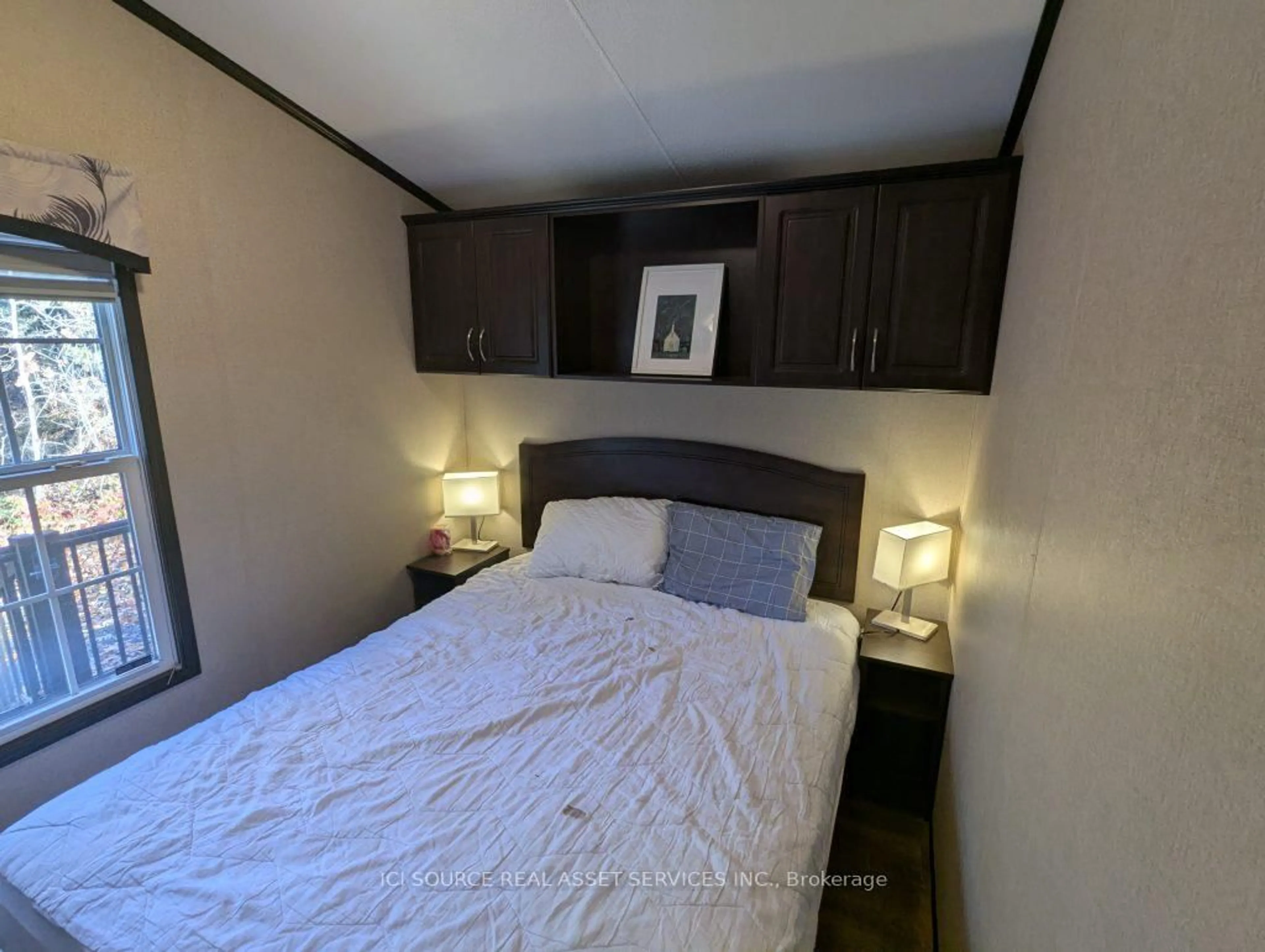 Bedroom with bed, wood/laminate floor for 1336 S Morrison Lake Rd #MOR14, Gravenhurst Ontario P0E 1G0