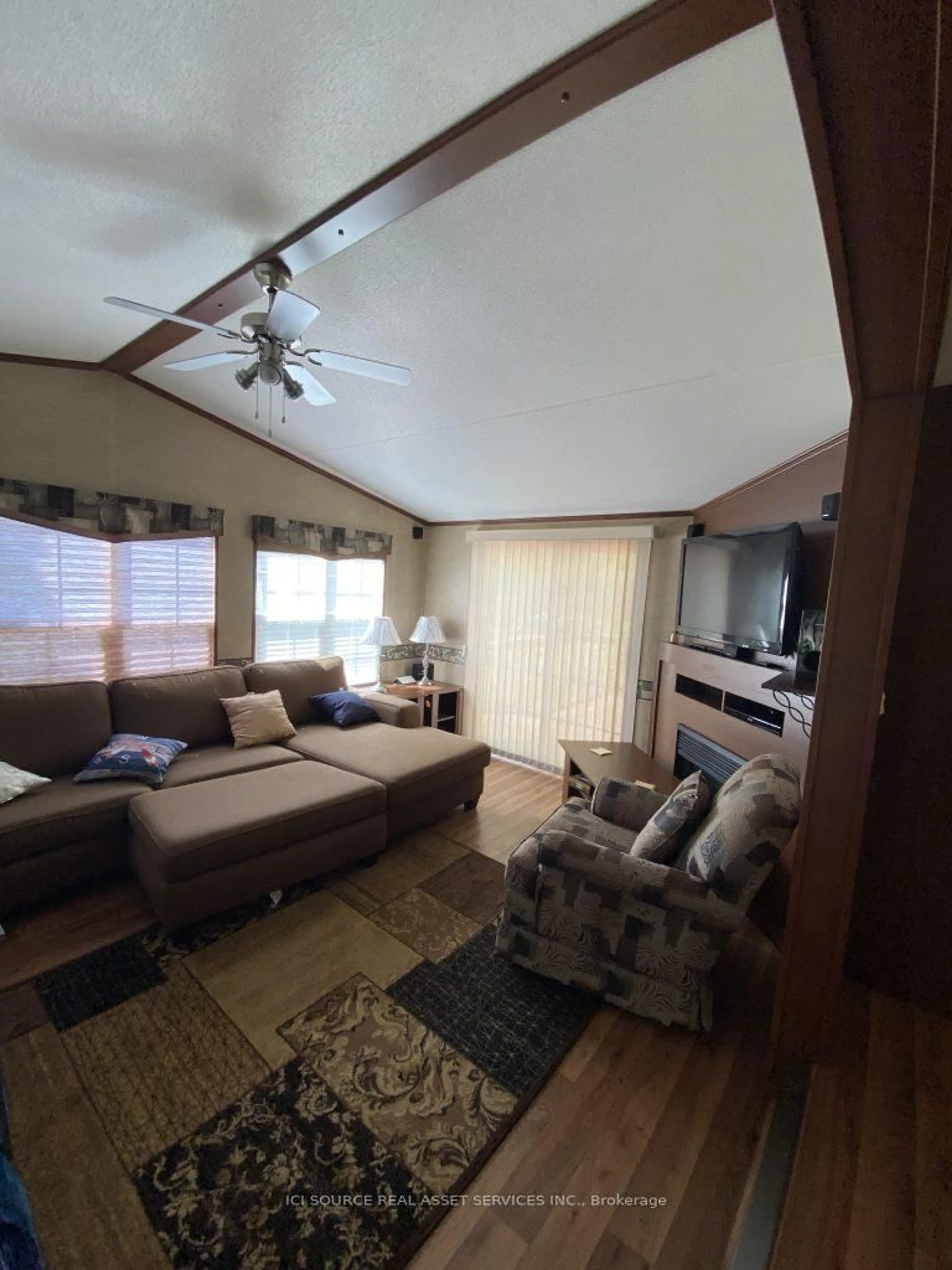 Living room with furniture, wood/laminate floor for 1336 Morrison Lake Rd #MPR20, Gravenhurst Ontario P0E 1G0