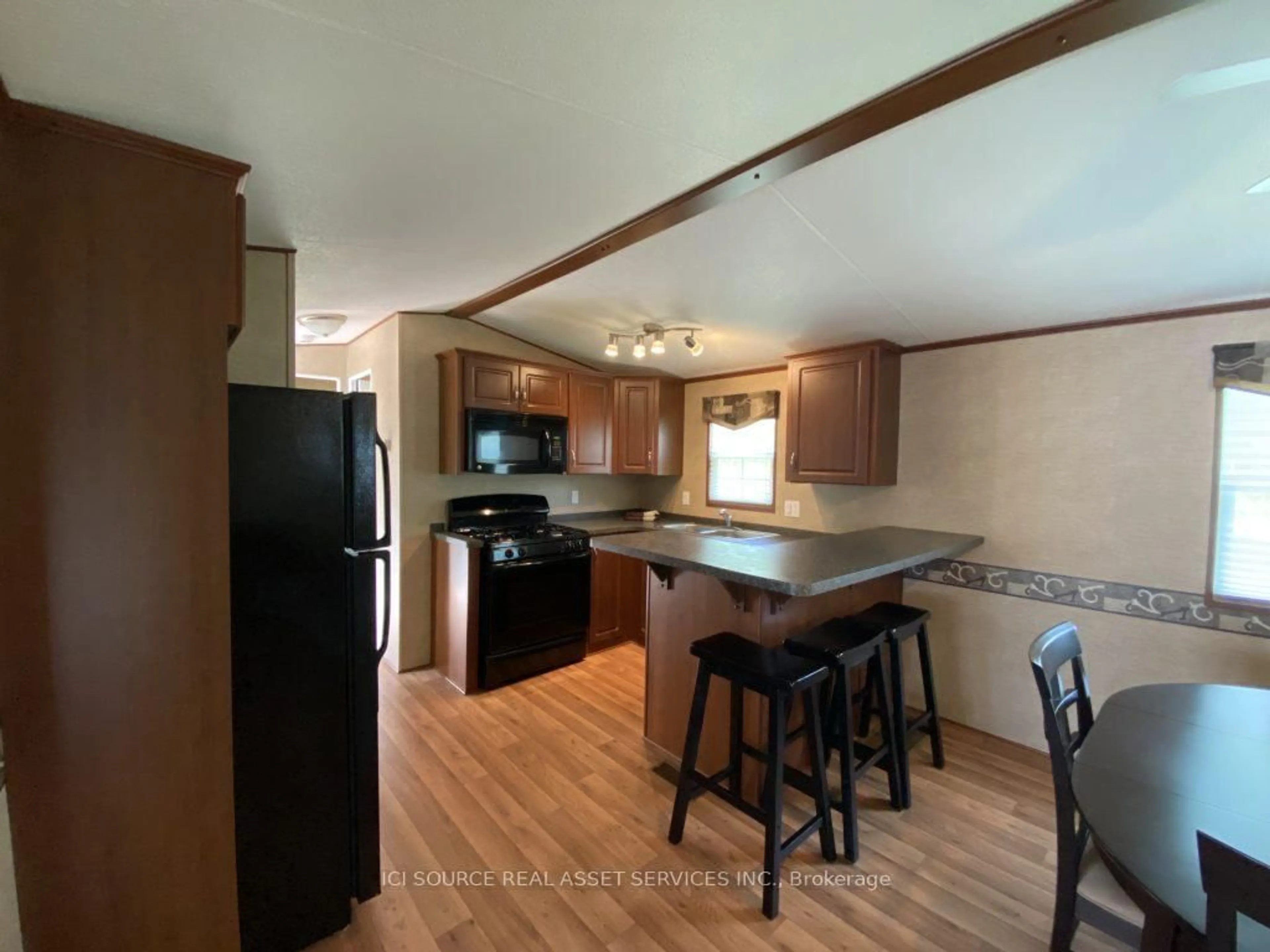 Open concept kitchen, wood/laminate floor for 1336 Morrison Lake Rd #MPR20, Gravenhurst Ontario P0E 1G0