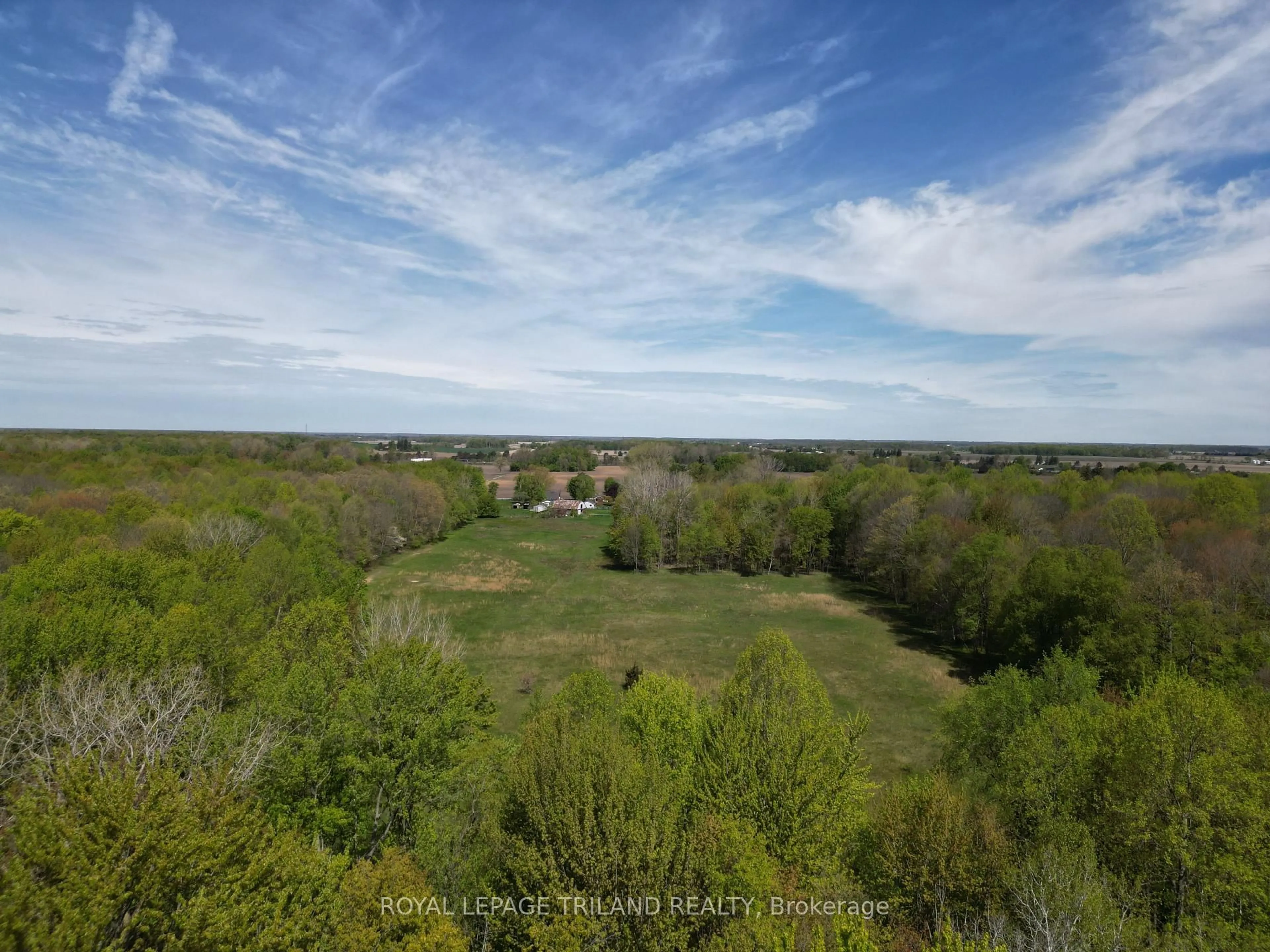 A pic from outside/outdoor area/front of a property/back of a property/a pic from drone, forest/trees view for 24909 Queens Line, West Elgin Ontario N0L 2P0