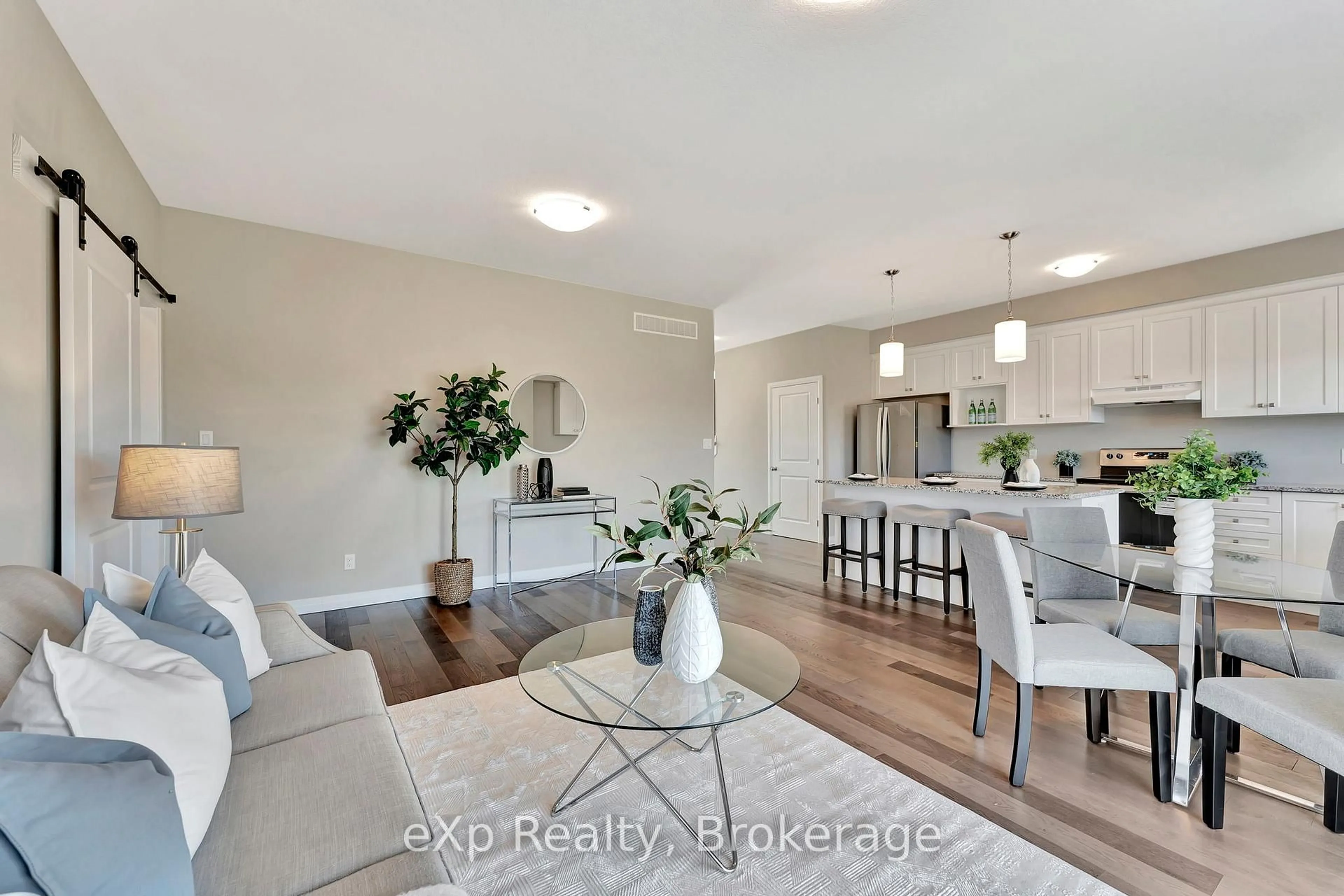 Living room with furniture, wood/laminate floor for 106 O.J Gaffney Dr, Stratford Ontario N5A 0K9