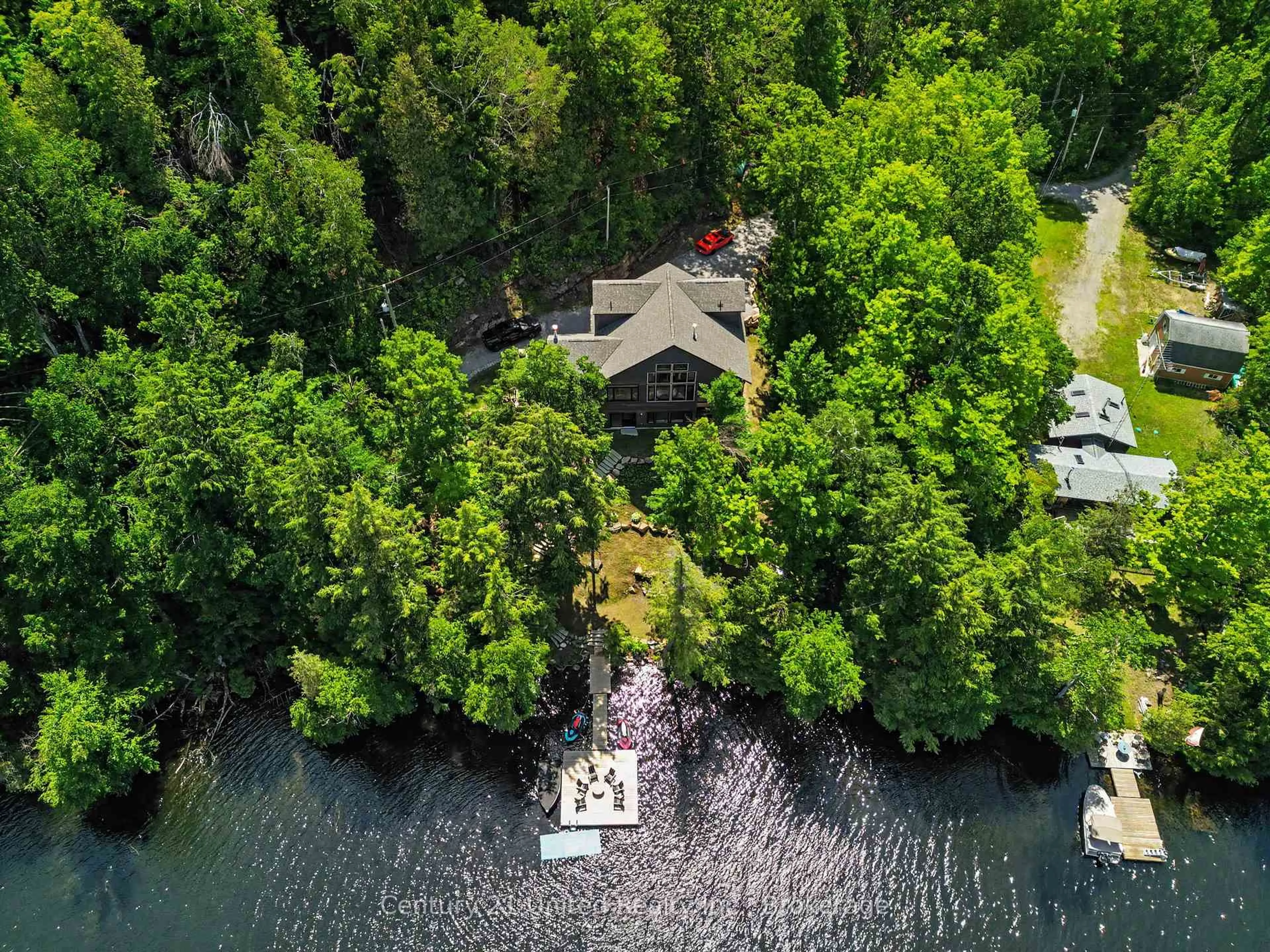 A pic from outside/outdoor area/front of a property/back of a property/a pic from drone, water/lake/river/ocean view for 1106 Lucky Copper Tr, Highlands East Ontario K0M 2A1