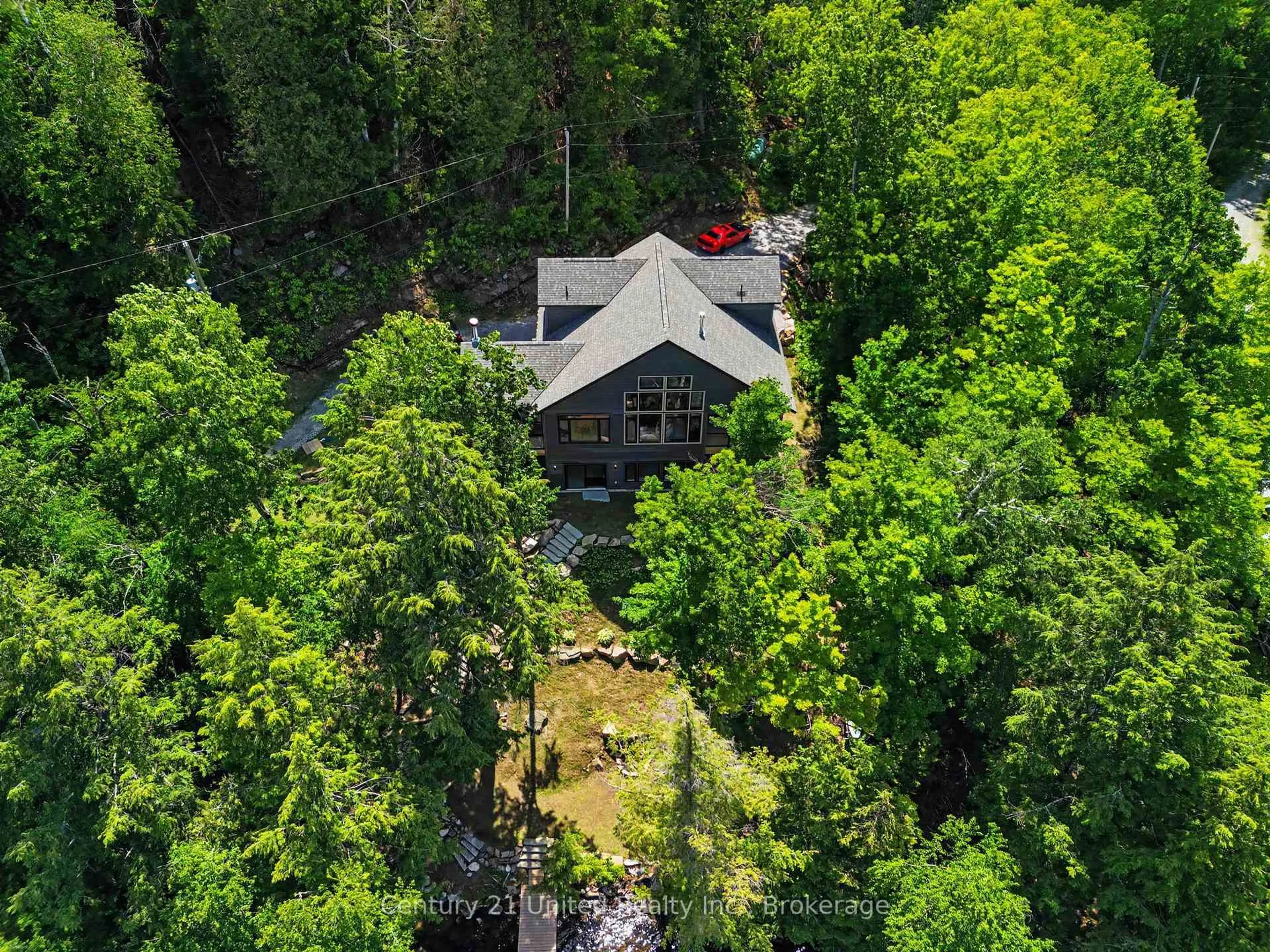 A pic from outside/outdoor area/front of a property/back of a property/a pic from drone, forest/trees view for 1106 Lucky Copper Tr, Highlands East Ontario K0M 2A1