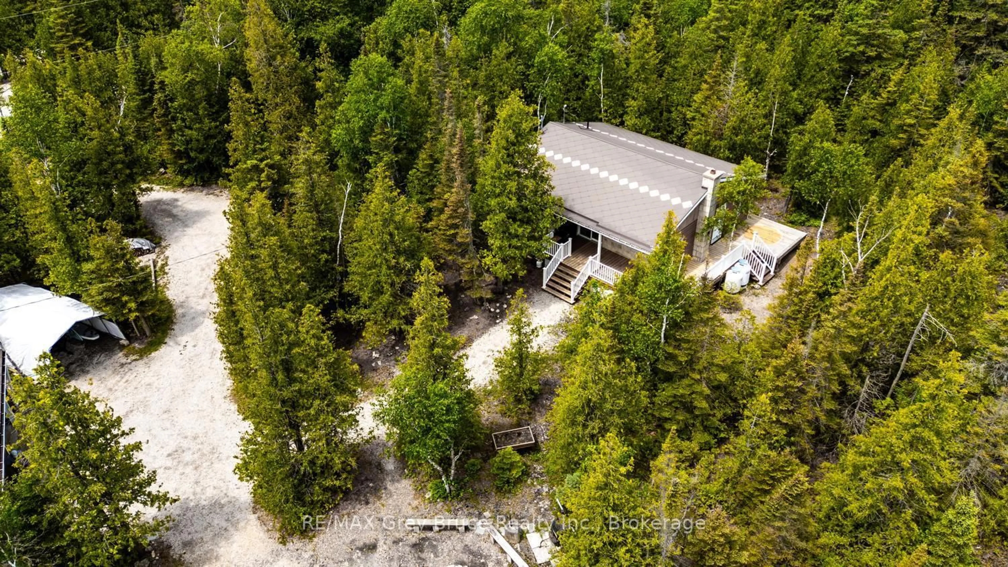 A pic from outside/outdoor area/front of a property/back of a property/a pic from drone, forest/trees view for 259 Bradley Dr, Northern Bruce Peninsula Ontario N0H 1Z0