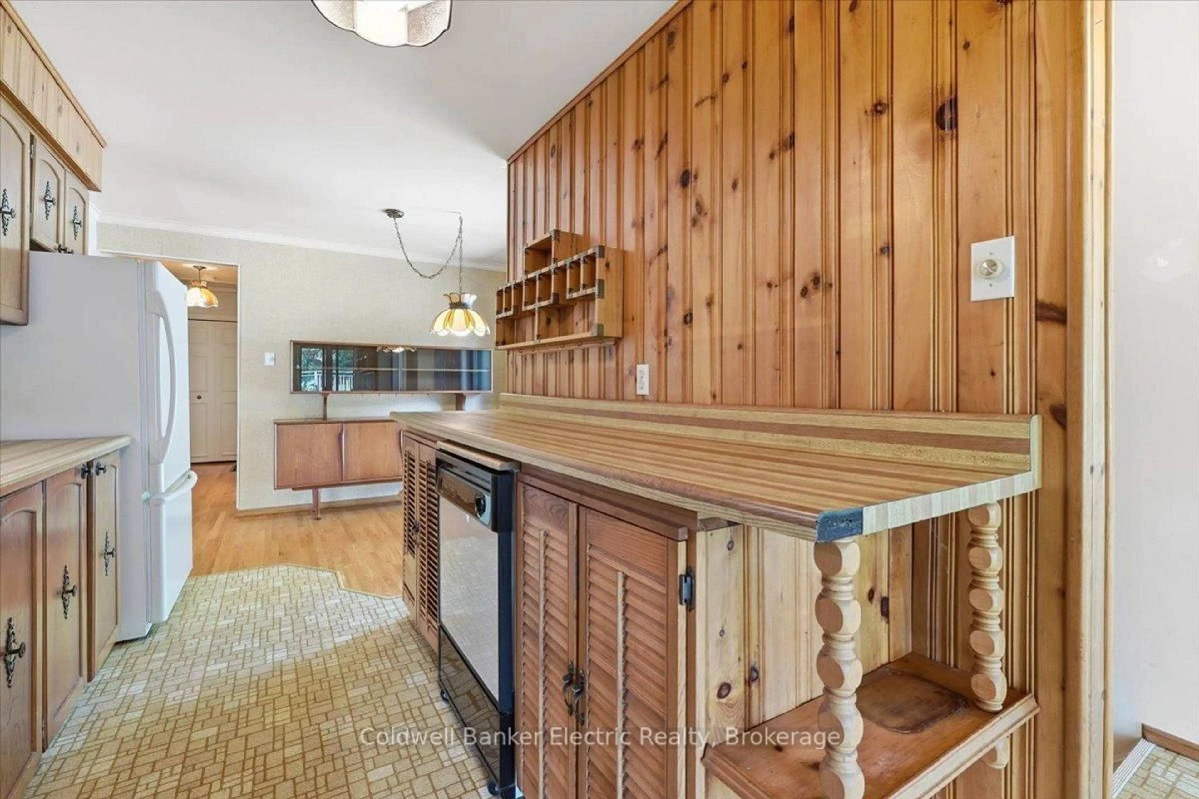Open concept kitchen, wood/laminate floor for 951 St. Paul's St, Peterborough Ontario K9H 6J7