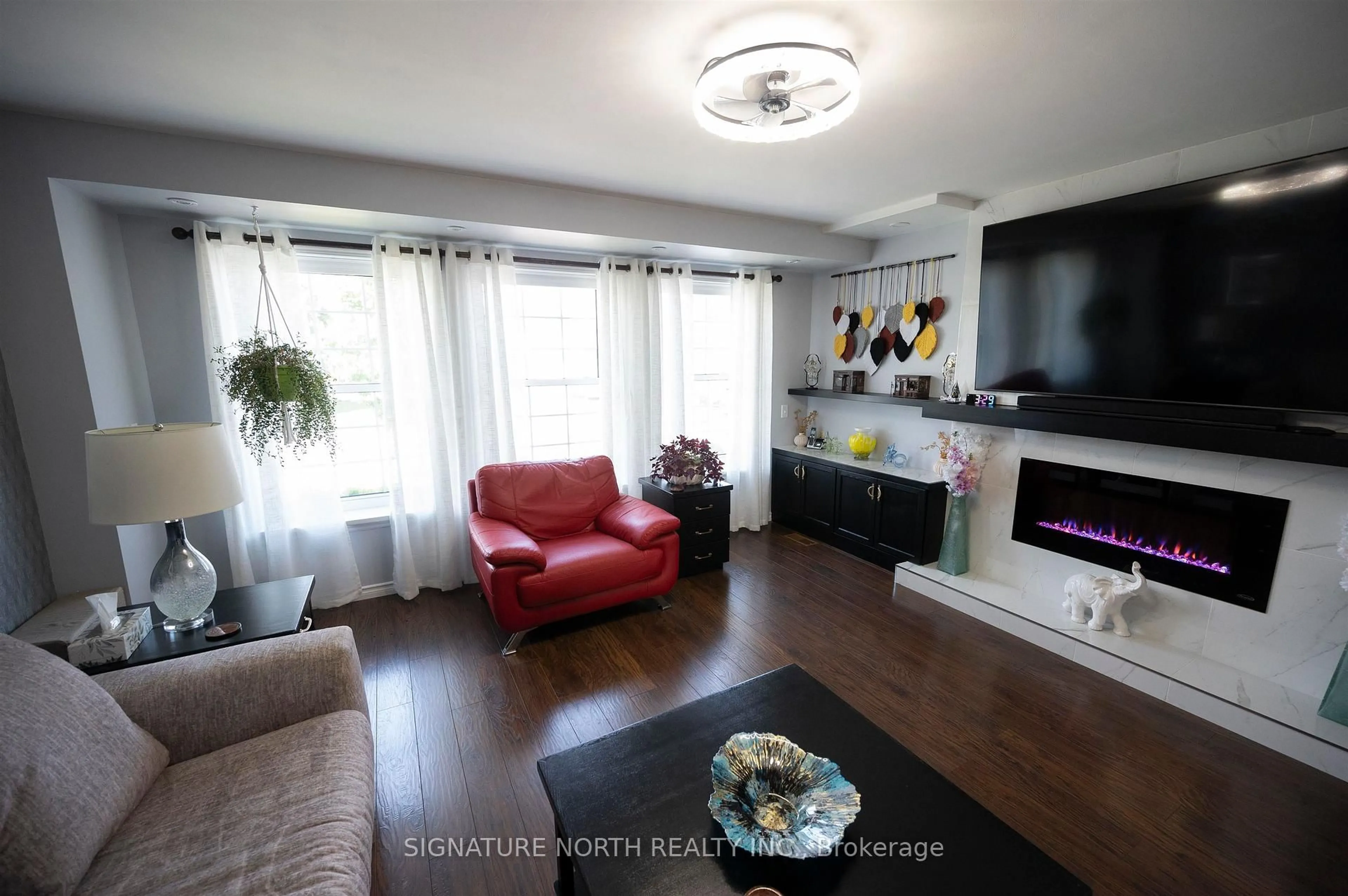 Living room with furniture, wood/laminate floor for 374 Mary Street East, Thunder Bay Ontario P7E 4J9