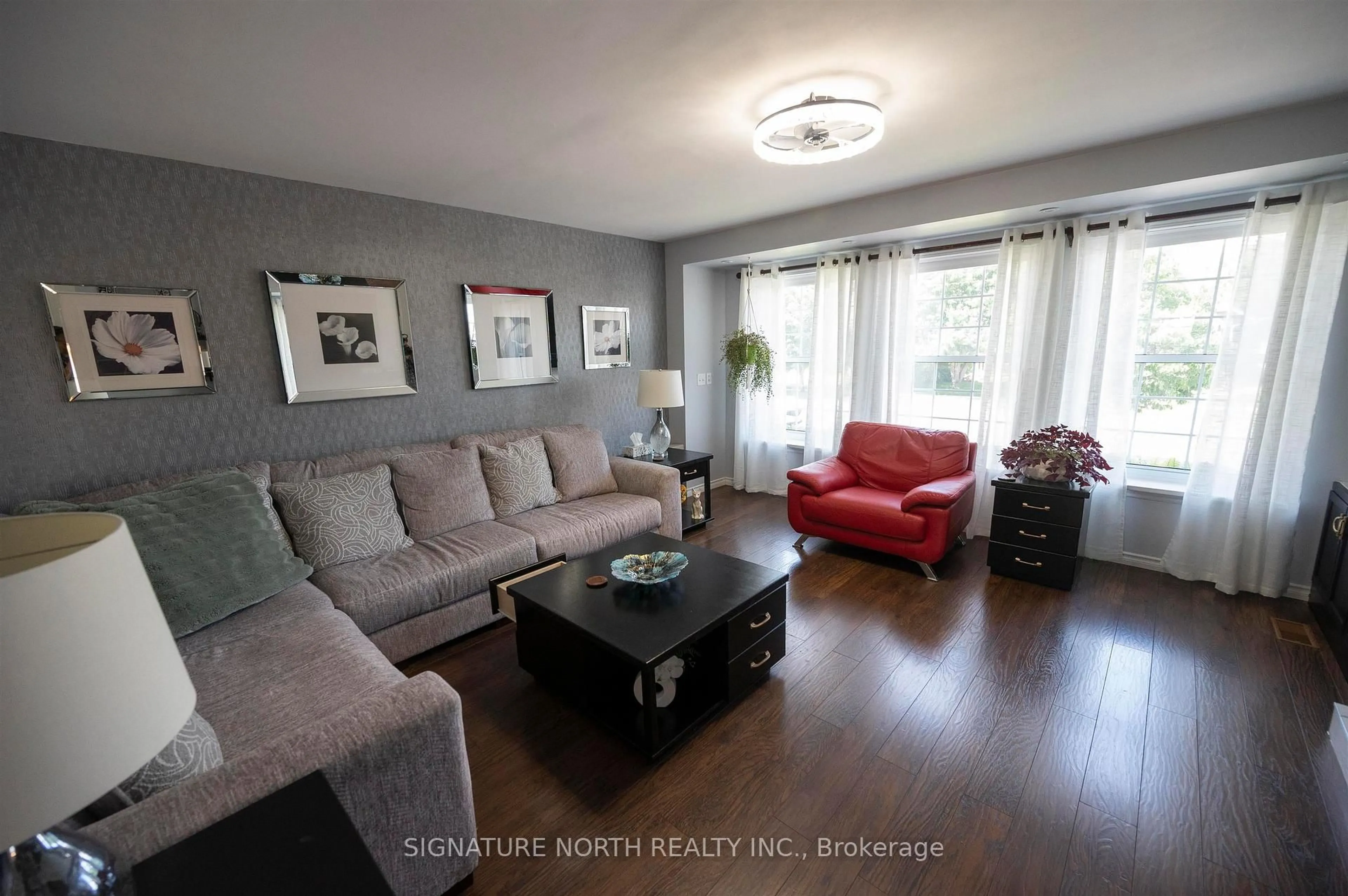 Living room with furniture, wood/laminate floor for 374 Mary Street East, Thunder Bay Ontario P7E 4J9