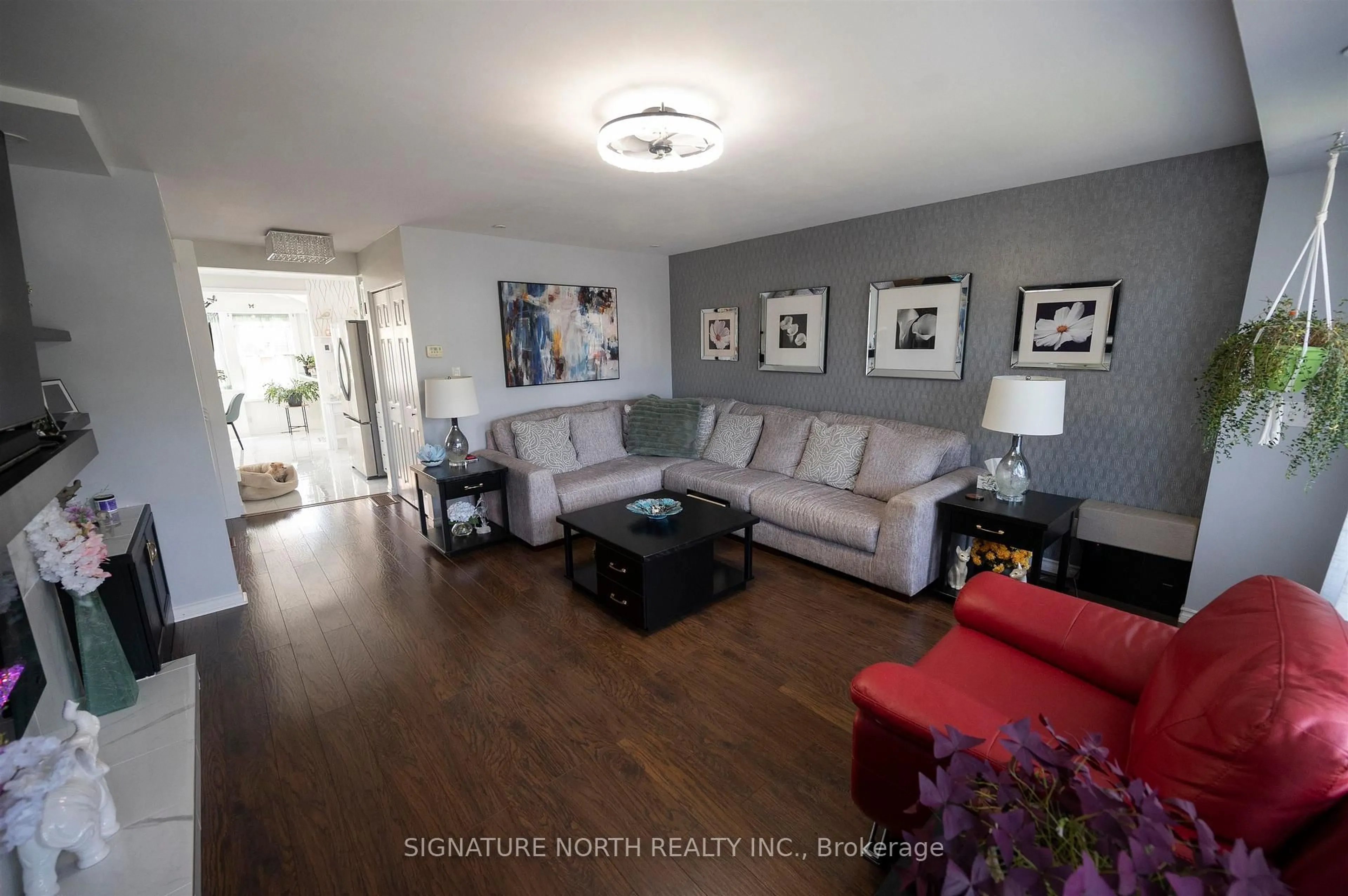 Living room with furniture, wood/laminate floor for 374 Mary Street East, Thunder Bay Ontario P7E 4J9