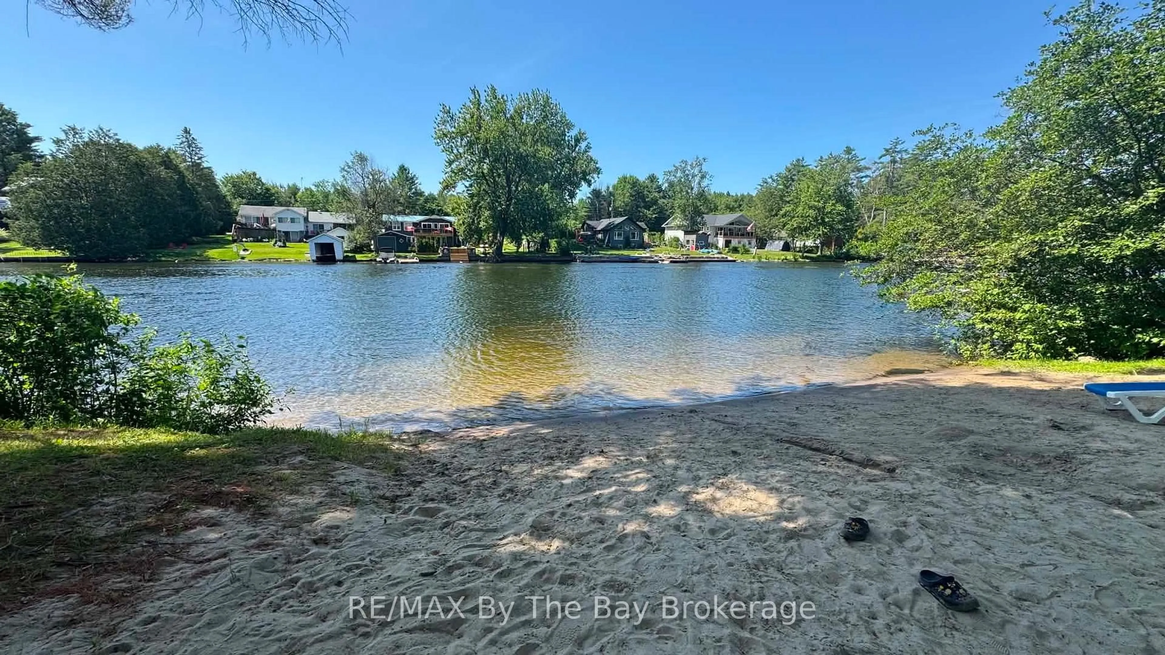 A pic from outside/outdoor area/front of a property/back of a property/a pic from drone, water/lake/river/ocean view for 1082 Shamrock Marina Rd #210, Gravenhurst Ontario P0E 1N0