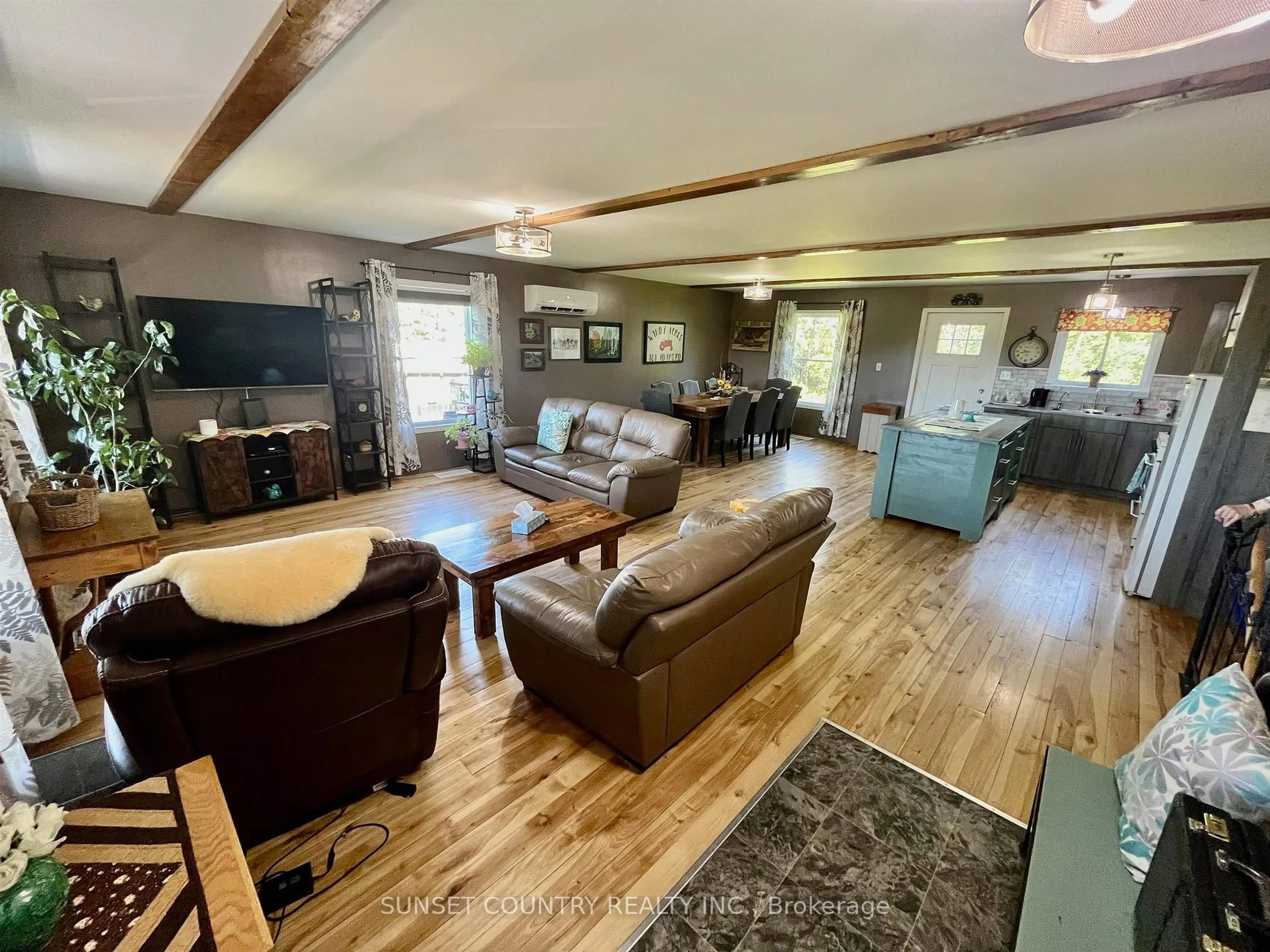 Living room with furniture, wood/laminate floor for 101 Adams Rd, Kenora Remote Area Ontario P0V 2J0