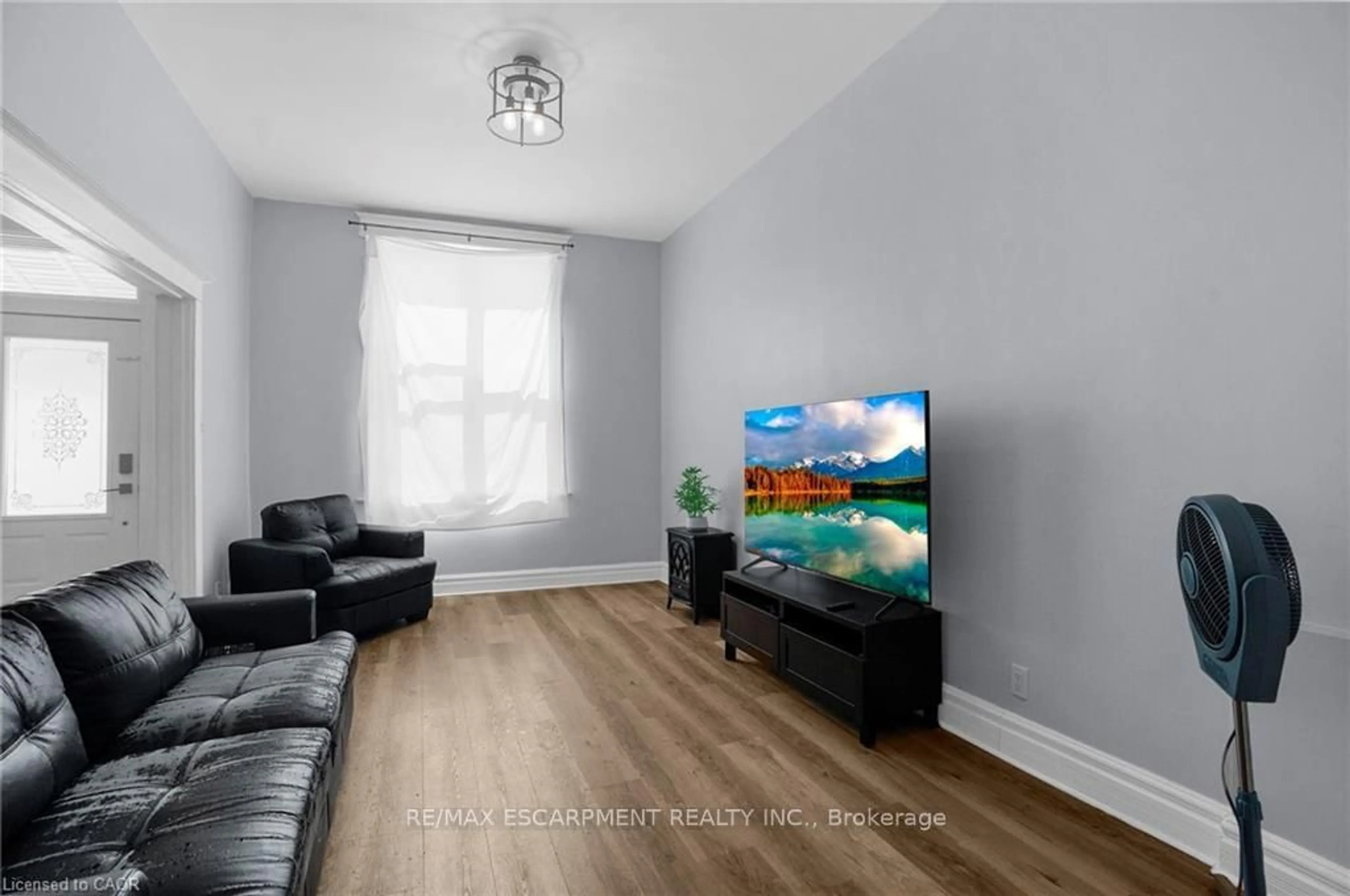 Living room with furniture, wood/laminate floor for 11 Wright Ave, Hamilton Ontario L8L 2T5