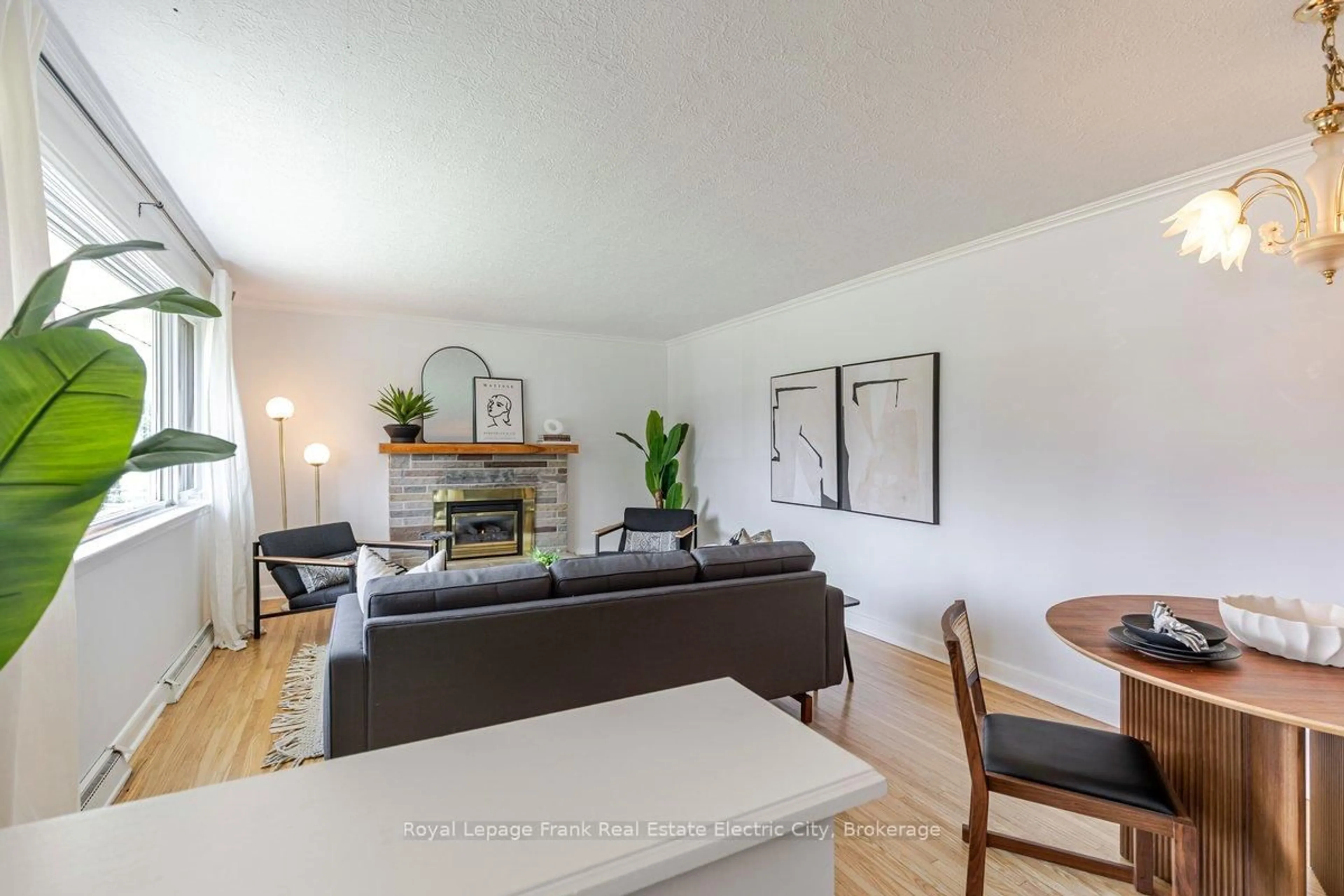 Living room with furniture, wood/laminate floor for 638 Crawford Dr, Peterborough Ontario K9J 3W7