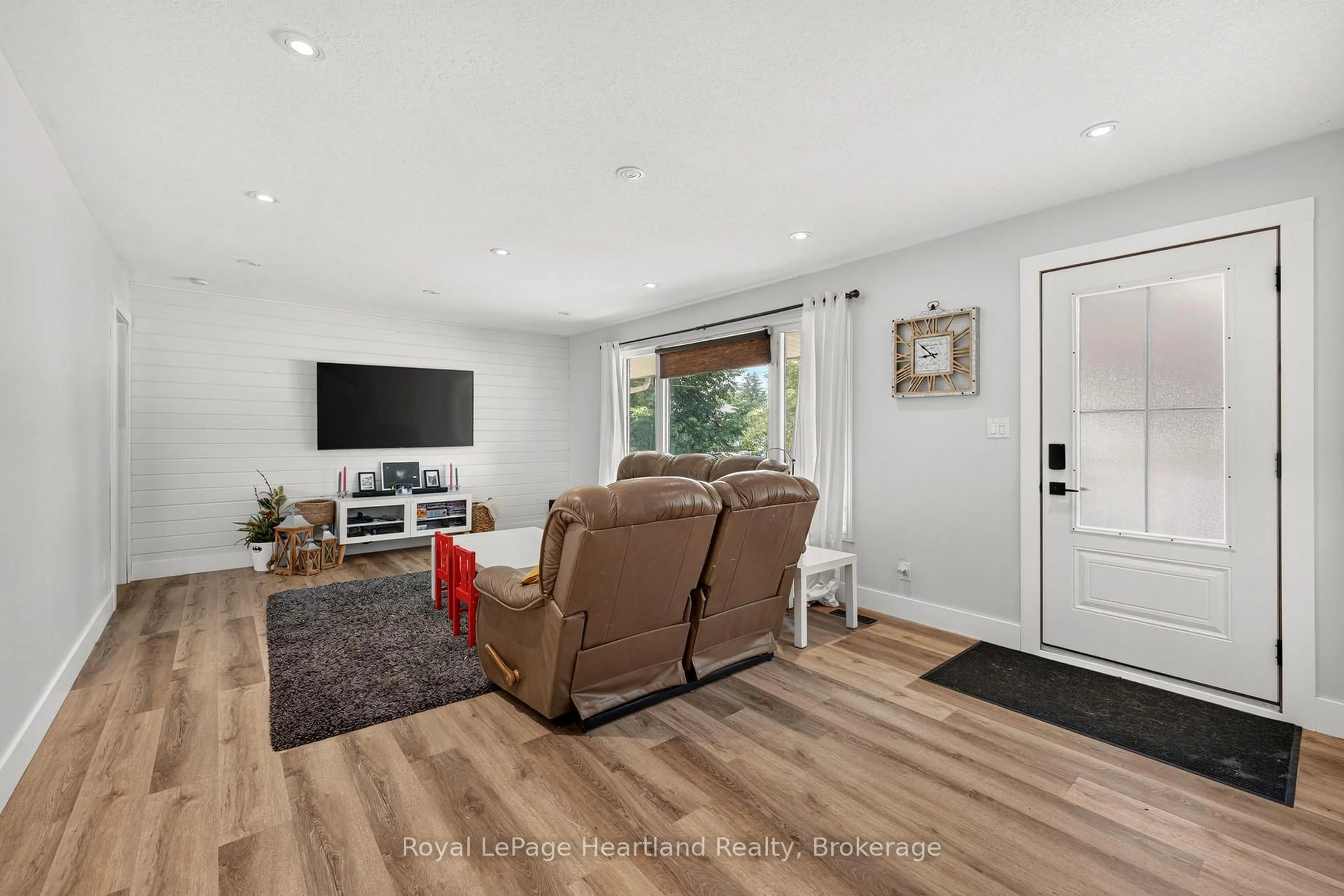 Living room with furniture, wood/laminate floor for 240 Elm Ave, North Perth Ontario N4W 3E8