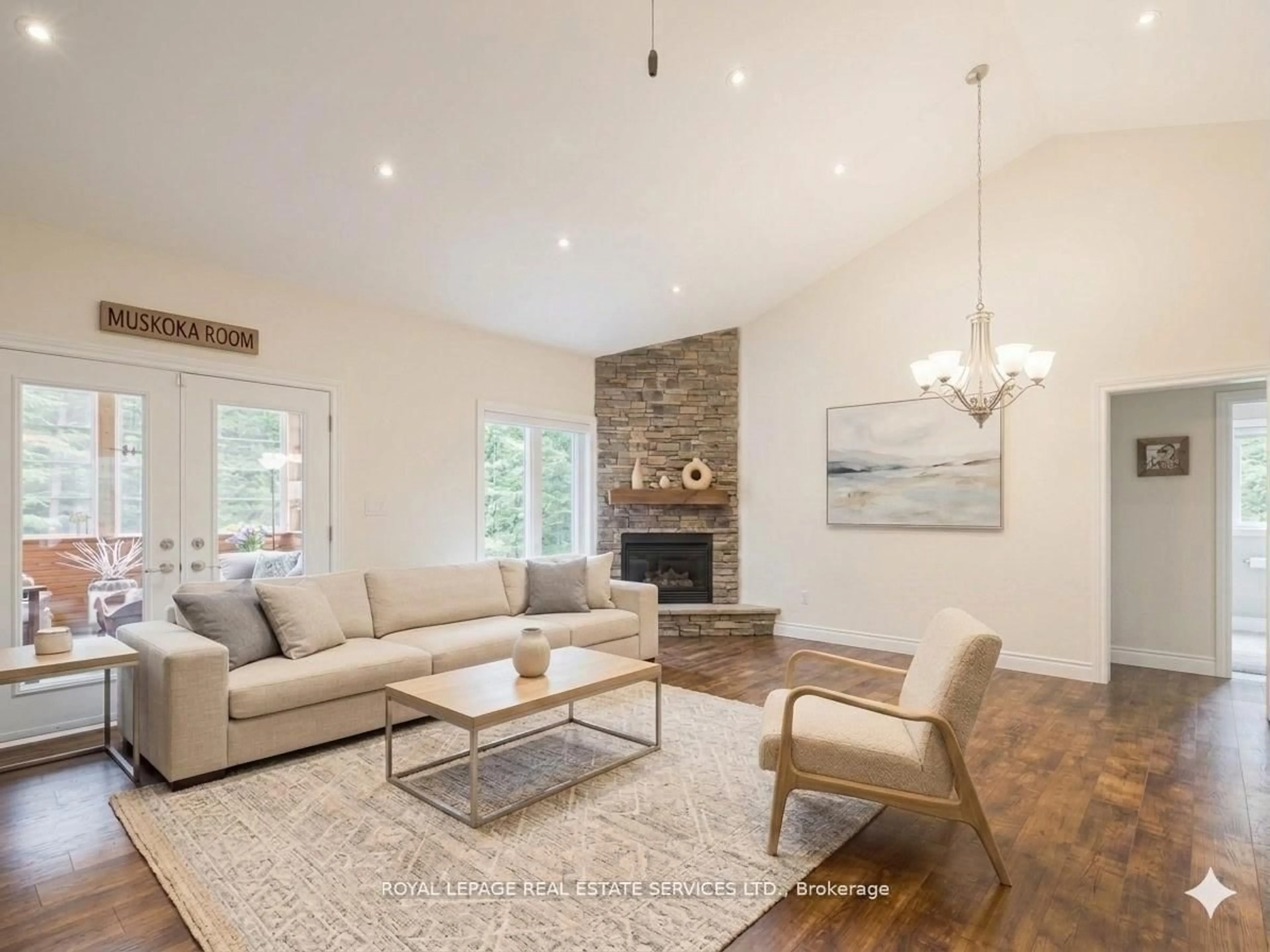 Living room with furniture, wood/laminate floor for 1045 Tower Cres, Gravenhurst Ontario P0E 1G0