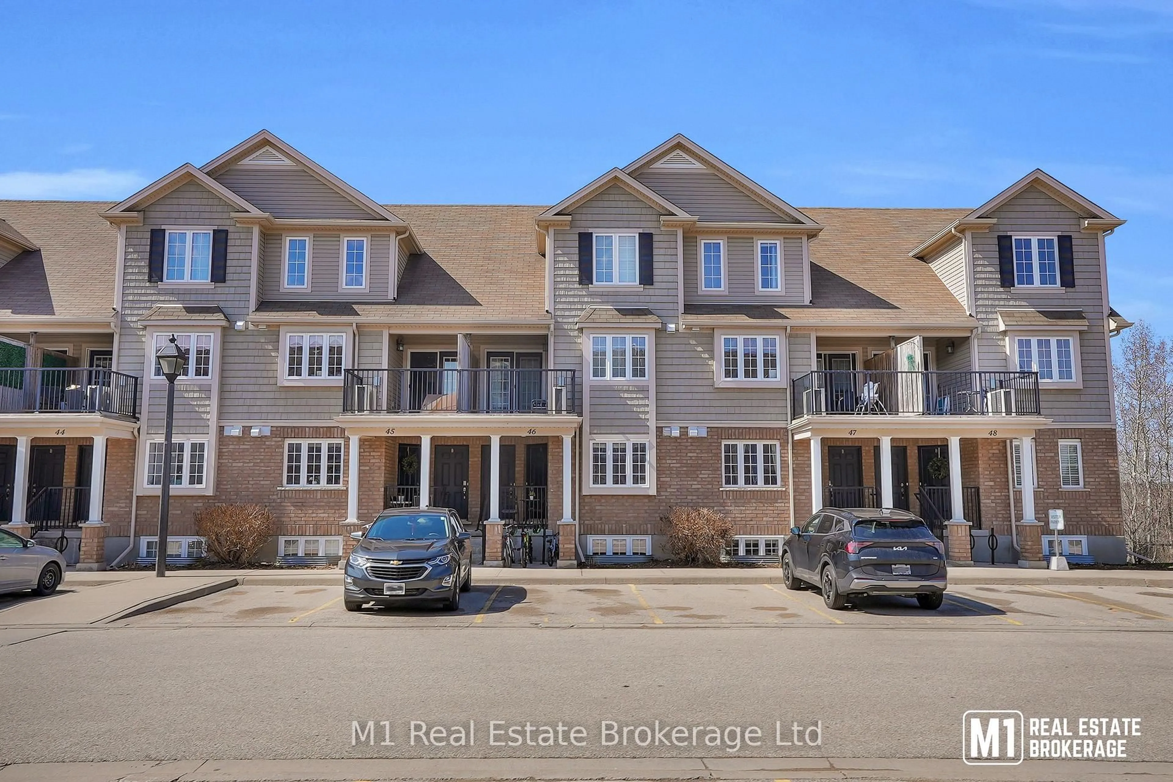A pic from outside/outdoor area/front of a property/back of a property/a pic from drone, street for 15 Carere Cres #46B, Guelph Ontario N1E 0K4