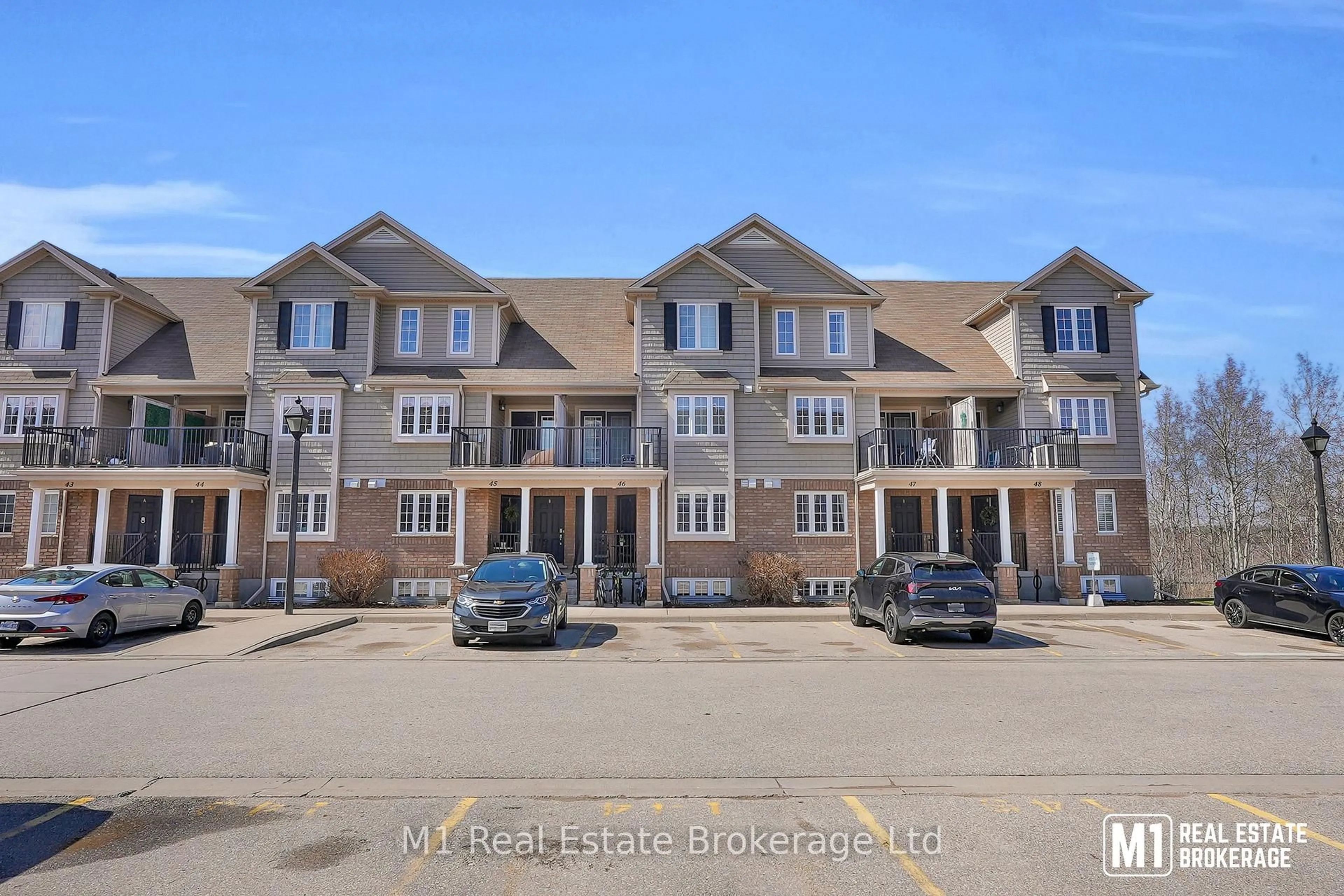 A pic from outside/outdoor area/front of a property/back of a property/a pic from drone, street for 15 Carere Cres #46B, Guelph Ontario N1E 0K4
