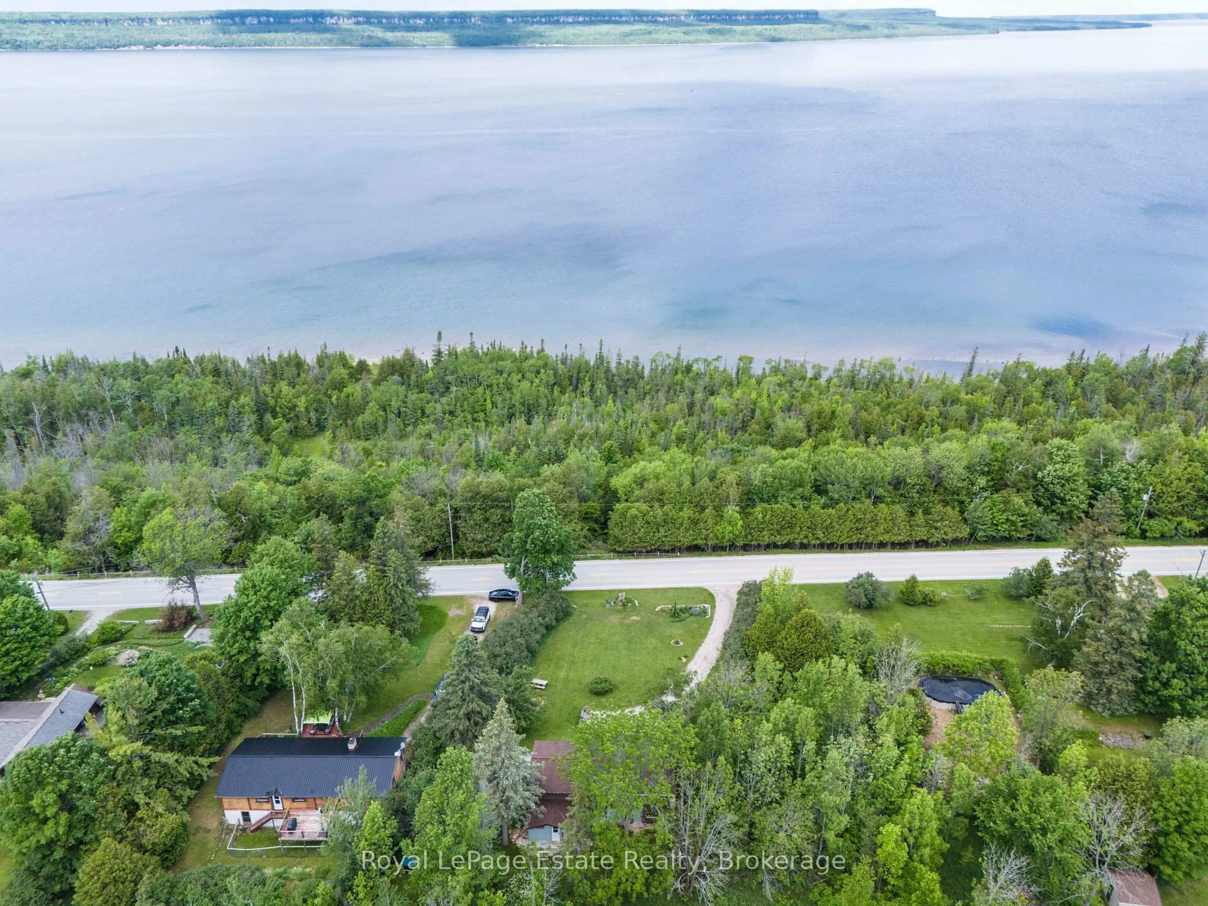 A pic from outside/outdoor area/front of a property/back of a property/a pic from drone, water/lake/river/ocean view for 502788 Grey Road 1, Georgian Bluffs Ontario N0H 2T0