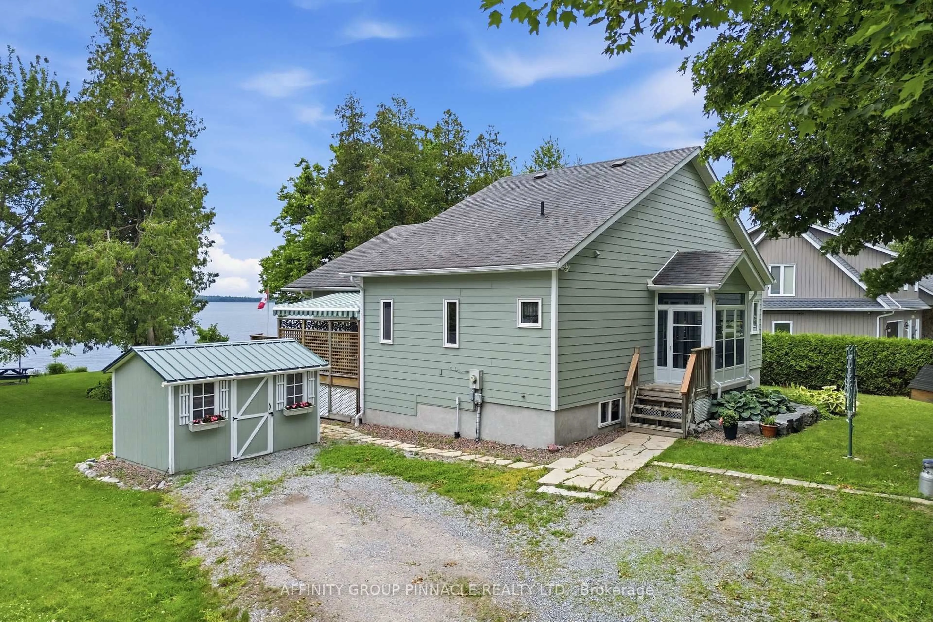 A pic from outside/outdoor area/front of a property/back of a property/a pic from drone, water/lake/river/ocean view for 58 Fire Route 98 Rte, Trent Lakes Ontario K0M 1A0