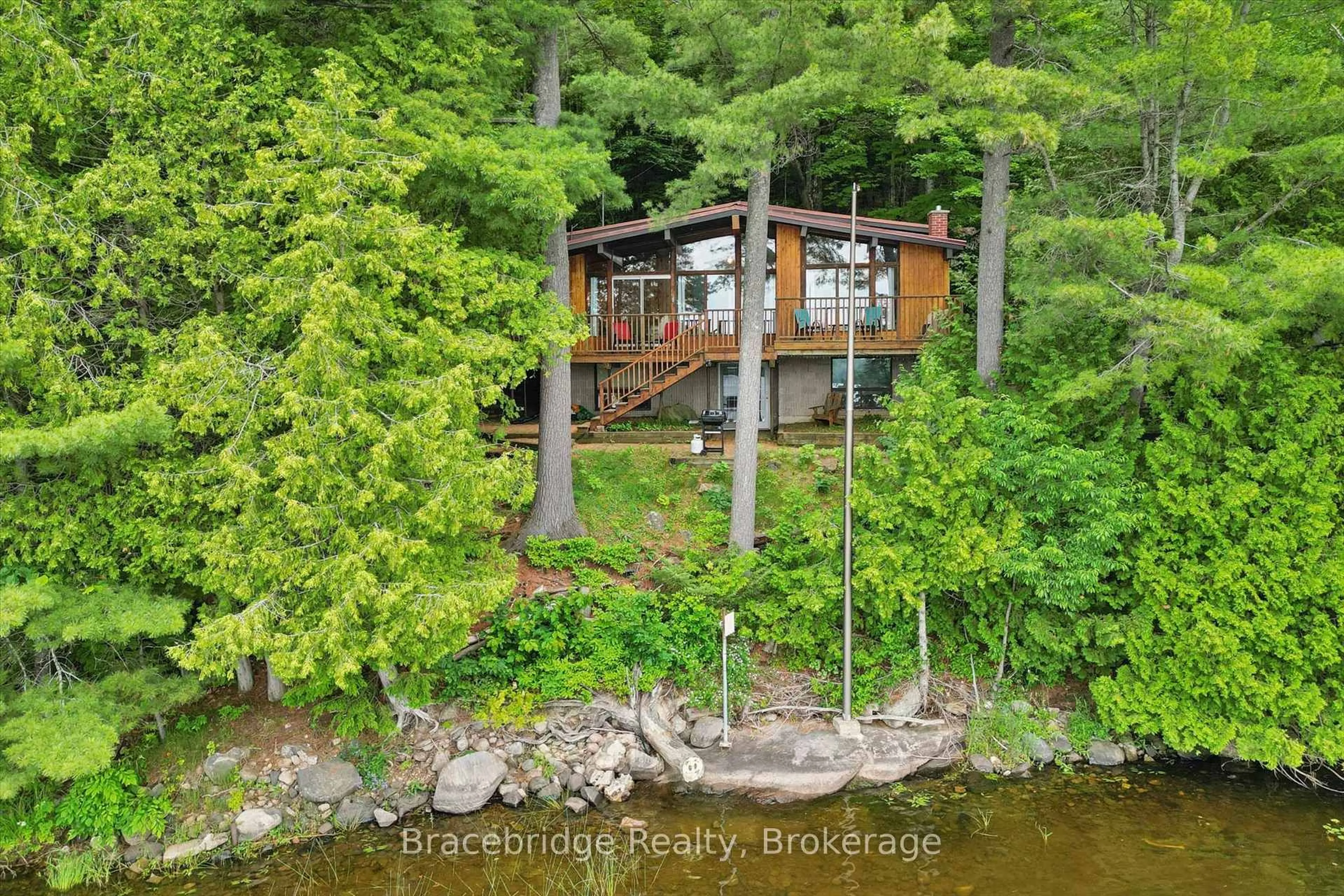 A pic from outside/outdoor area/front of a property/back of a property/a pic from drone, water/lake/river/ocean view for 8-1125 Carlo Enterprise Rd, Muskoka Lakes Ontario P0B 1M0